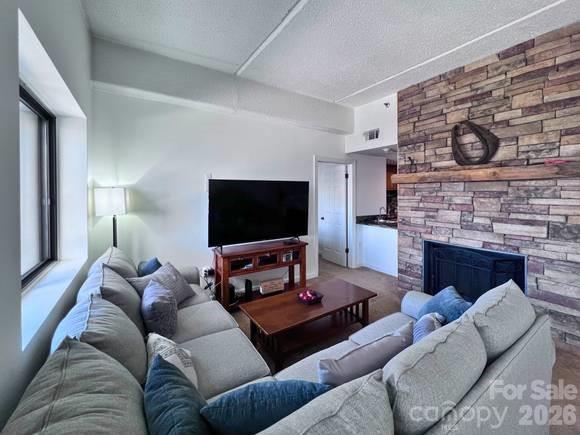Welcome to Sugar Top, Unit 2323. From the moment you step inside, you’ll be captivated by stunning long-range mountain views and breathtaking ski slope views during the winter months. The living room features a cozy wood-burning fireplace, where you will want to spend chilly evenings, while the outdoor patio offers westward views and unforgettable sunsets. Inside, the open-concept living space showcases tray ceilings, tongue-and-groove accents, granite countertops, a wet bar, and more. All bathrooms have been updated, and the Primary Bedroom is en suite. The unit includes a washer and dryer for added convenience. This is a fully furnished unit, excluding a few personal items and makes this property exceptional for personal use, vacation rentals, or long-term rental income. A $1,500 buyer transfer fee is due at closing. Sugar Top amenities include an indoor heated pool, sauna, hot tubs, fitness center, coffee bar, adult beverages in the lobby Overlook Tavern and a welcoming stone fireplace for all guest to enjoy while the breathtaking view of Grandfather Mountain is sure to impress. Utilities included in the HOA fee are Cable TV, Internet, Trash Removal and Land Line Phone. The gated community also provides 24-hour security with staffed lobby desk service. Don’t miss this opportunity to invest in a truly one-of-a-kind mountain retreat.
