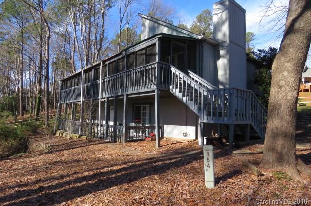 A wonderfully-affordable opportunity to live in Tega Cay - known for it's many recreational amenities, including 27 holes of golf, waterfront parks, marina, neighborhood school & walking trails! Priced to sell! Update to suit your liking! Waterview with four nice-size bedrooms + 3 Full Baths! Huge screen porch across the back of the home accessible from Master BR & kitchen, and covered patio on lower level. Large family room w/ FP. Adj. 2 waterview lots also available for purchase with the home.