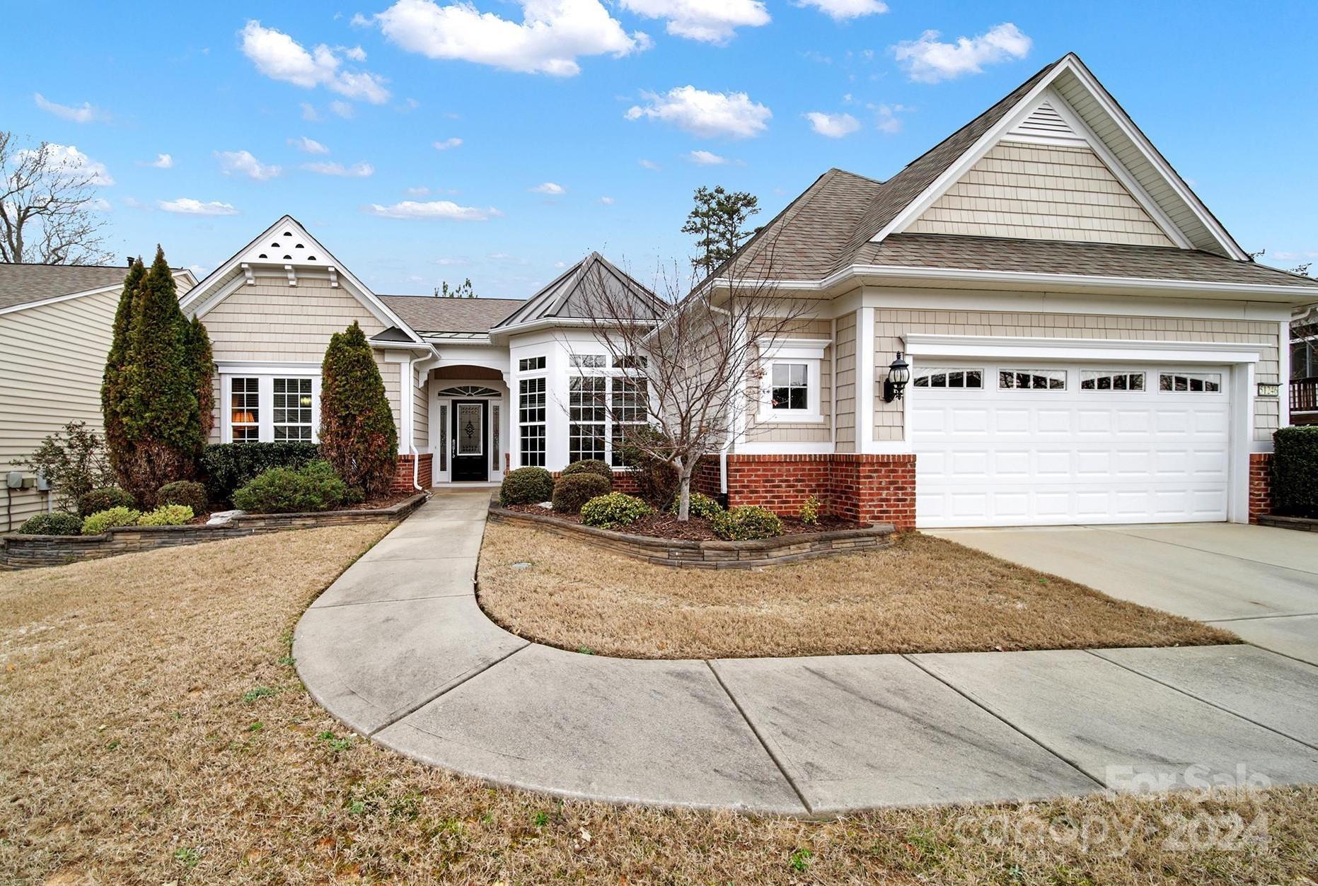 Cumberland Hall w/ a 3-season room + on the golf course! Lovely curb appeal w/ the partial brick exterior & front garden beds. Neutral paint, elegant crown molding, tons of natural light, & prefinished wood flooring in the main living areas! The chef's kitchen boasts granite counters, SS appliances, gas cooktop, wall oven & microwave, long & spacious island, double door pantry, & a sunny breakfast nook! Cozy up to the gas-log fireplace in the great room during the cooler months & enjoy the spacious 3-season room w/ tile flooring while watching the golfers! The primary suite has a tray ceiling & a bathroom w/ a soaking tub, dual sink vanity, glass shower, & a walk-in closet! 2 guest bedrooms w/ a Jack-and-Jill bathroom are perfect for overnight guests. There is also an office/den w/ French doors- ideal for working from home or to use as a hobby room! The rear paver patio is a great spot to relax, grill out, & host friends & family! Join the active-adult lifestyle in Sun City today!