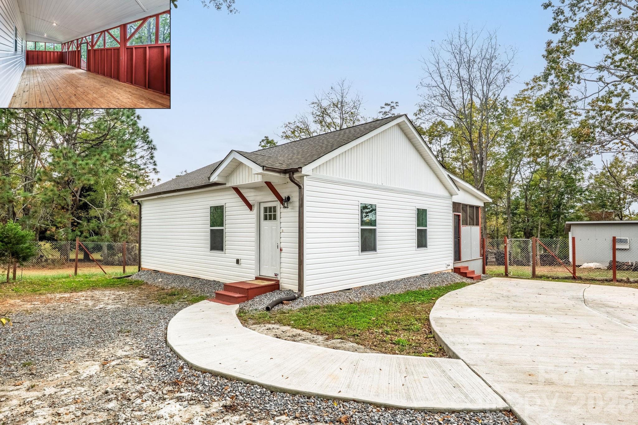 Nearly new ranch home on point .79 acre lot with no HOA! This adorable home features a nice open living area with grand cathedral ceiling and luxury vinyl plank flooring which seamlessly opens to the beautiful kitchen and dining area. The large open space lends to several seating options and is also great for entertaining and gatherings over the holidays! You'll love the beautiful upgrades in the kitchen including granite counters, farmhouse sink, tile backsplash, built in pantry, hood vent, soft close cabinetry and stainless refrigerator. The dining area leads to the wonderful back porch, almost 400 sqft in size, mostly enclosed but has a screen perimeter along the top for nice ventilation along with a vaulted ceiling. Relax in the large primary suite, complete with walk-in closet, ceiling fan and upgraded bath with a beautiful tile surround shower. Bedroom 2 is ample in size and has 2 closets. The large lot is entirely fenced and has 3 like-new outbuildings providing tons of storage space. There is plenty of parking in the concrete driveway and also side gravel area for extra vehicles, camper, etc. Conveniently connected to city water and city sewer. This home has amazing views of the surrounding mountains and is located close to town with shopping, dining, healthcare, Lowes, Walmart and so much more! Qualifies for USDA financing with NO down payment.