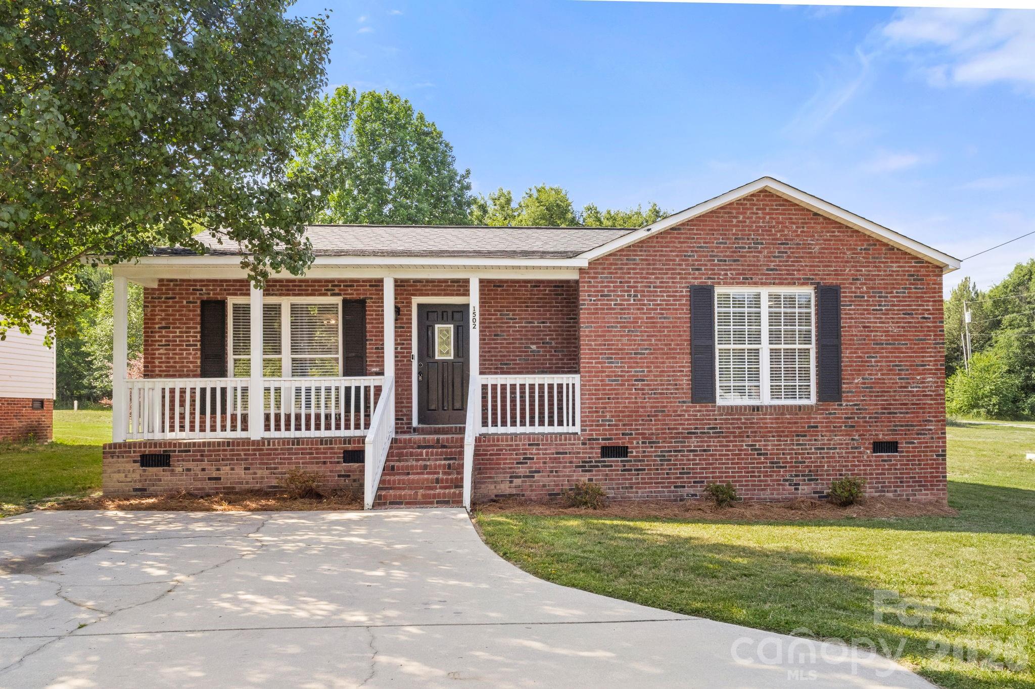 This charming 3-bedroom, 2 full bathroom brick home in Cherryville offers comfort, convenience, and a great layout for everyday living! Conveniently located to Shelby, Gastonia, and Lincolnton, this home features an open concept living area with a spacious family room and eat-in kitchen perfect for gathering with family and friends. Kitchen appliances do convey. The spacious primary bedroom features a full en-suite bathroom along with his and her closets for added comfort and convenience. Step outside onto the deck overlooking the large fenced backyard — ideal for entertaining, pets, play, or simply relaxing outdoors. A wonderful opportunity to make this well-maintained home your own! Schedule your showing today!