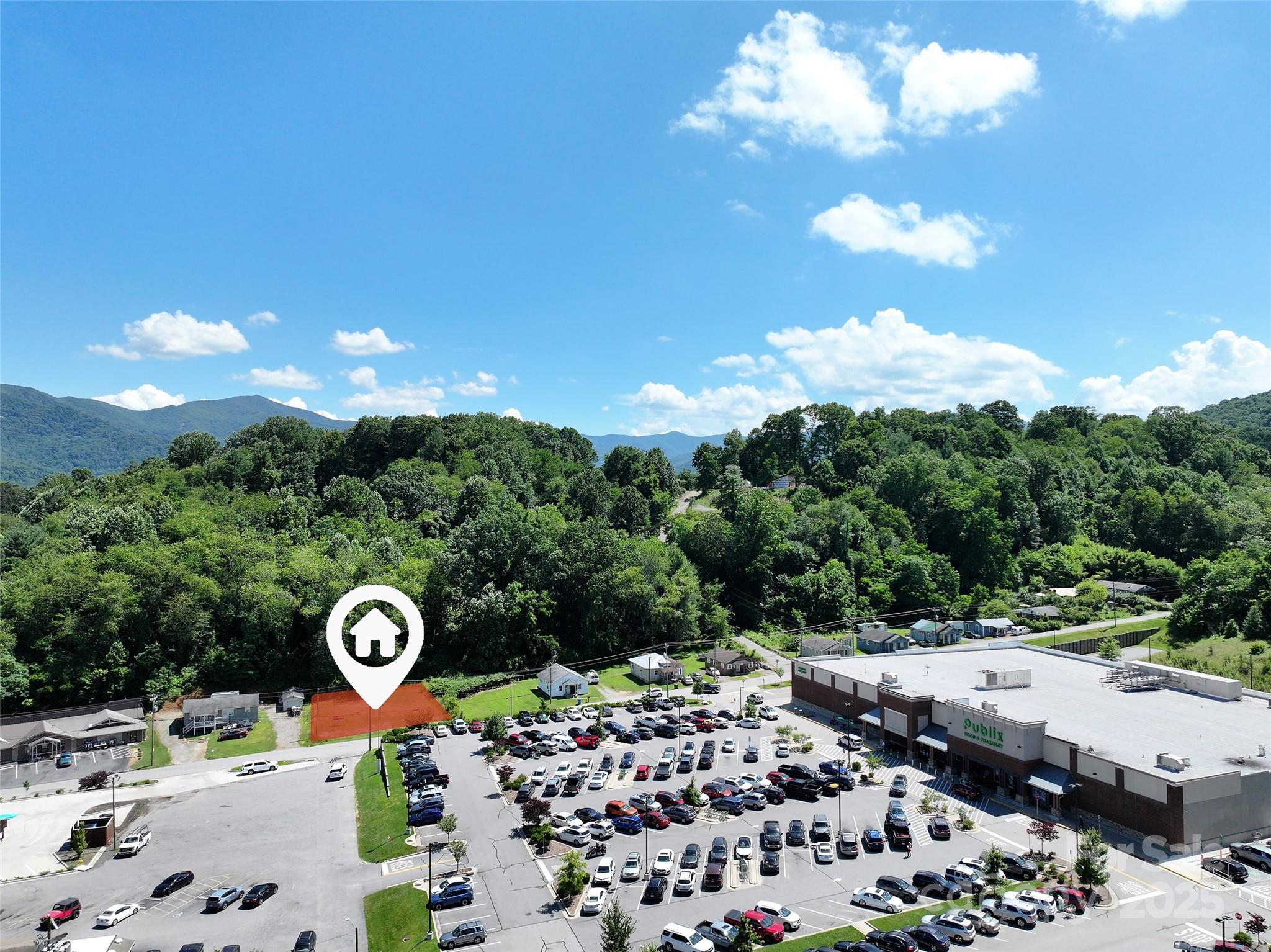 Prime Commercial Vacant Lot- Excellent Development Opportunity. Ideally situated in a high-visibility area with strong traffic counts and easy access to major roadways. This 0.24-acre parcel offers a blank canvas for your next retail, office, industrial or mixed-use project! See Town of Waynesville zoning use chart for permitted uses.