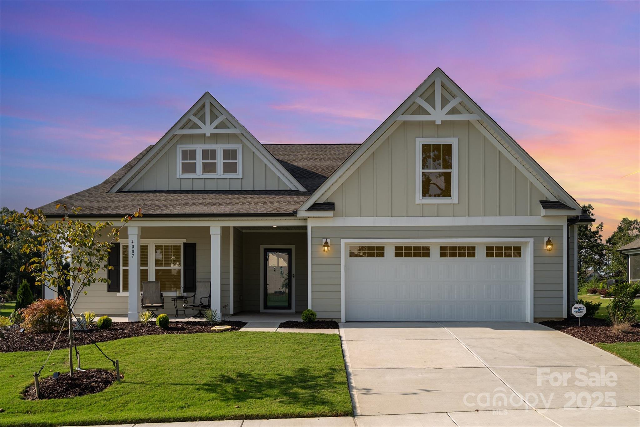 Fully custom golf course home on a private 1/2 acre home site! This stunning 3-bedroom, 2-bath single story home offers modern living in one of the Carolinas’ premier golf communities. Overlooking the 17th green and 18th fairway of the Carolinas' Top 100–ranked Stonebridge Golf Course, the home enjoys a southern-facing rear view and access to resort-style amenities including a pool and cabana, pickleball and tennis courts, and a fitness center. Inside, the thoughtfully designed floor plan is elevated with custom features throughout. The great room and kitchen showcase soaring 11’ coffered ceilings with recessed lighting, while the sunroom and extended dining area create the ideal spaces for both relaxation and entertaining. The chef’s kitchen features upgraded Lusso quartz countertops, 42” soft-close cabinetry with roll-out drawers, a stainless steel farm sink, under-cabinet lighting, and Frigidaire Professional appliances—including a gas oven. Retreat to the spacious primary suite, complete with a sitting room and a luxurious spa-like bathroom featuring large-format tile, premium cabinetry, and upgraded fixtures. Additional highlights include upgraded Pergo sustainable wood laminate flooring, wainscoting in the foyer, 8” baseboards, and whole-home custom blinds. Outdoor living is equally impressive with over 750 sq. ft. of extended patio space finished with concrete, tile, and pavers—perfect for enjoying tree-lined backyard views. Professional landscaping with expanded flower beds and a drip system enhances curb appeal, while Anderson storm doors, luxury lighting and ceiling fans, pre-wired audio, and a security system with video cameras ensure comfort and peace of mind. Practical upgrades include a garage bump-out with EV charger pre-wire, an enhanced HVAC system with high-performance filtration, and Sherwin Williams washable paint throughout the home. This is more than just a home—it’s a lifestyle, offering modern elegance, community amenities, and breathtaking views in one of the Carolinas’ most sought-after golf communities! Roughly 10 minutes to downtown Waxhaw where you can enjoy endless events, shopping and restaurants!