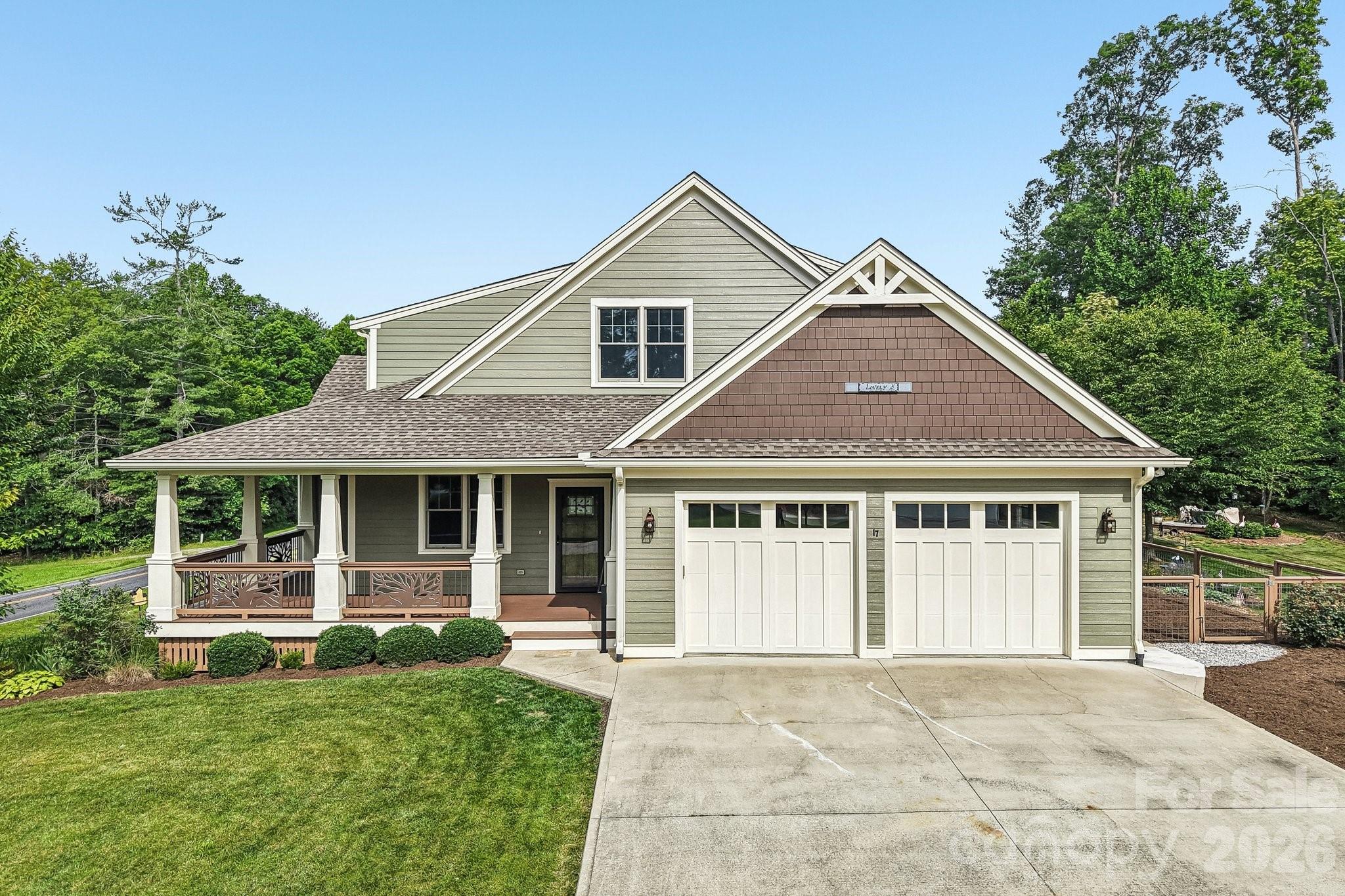 First time offered!  Custom home ideally located between Brevard & Hendersonville.  Features quality craftsmanship, lots of hardwood flooring, wooden coffered ceiling in the living room, tray, vaulted, cathedral and 9' ceilings throughout.  Well equipped kitchen w/generous cabinetry, gas range, breakfast bar, walk-in pantry & spacious dining area.  Three bedroom suites.  Freshly painted exterior siding.  Partially poured crawlspace for gardening/storage.  Fenced area off garage, perfect for pets.  Oversized two car garage, covered rocking chair front porch and back deck w/pergola to enjoy the open, countryside views!