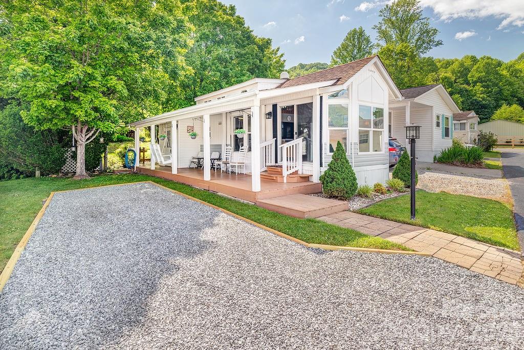 Immaculate and well-maintained park model located in a quiet 55+ community with paved roads and easy access to nearby conveniences. This 1 bedroom, 1 bath home offers approximately 395 sq ft of comfortable living space and features a galley kitchen with ample storage, a cozy living room filled with natural light, and a vaulted ceiling that creates an open and inviting atmosphere throughout.
A charming loft adds an additional 95 sq ft of floor space, making it the perfect sleeping area for the grandkids, a play space, or extra storage. They will absolutely love it!
Enjoy breathtaking year-round mountain views and the peaceful sounds of the nearby creek from the covered wraparound side and back decks—ideal for relaxing, entertaining, or simply soaking in the beauty of the mountains.
This property would make a wonderful year-round residence, seasonal getaway, or investment opportunity, with rentals allowed for a minimum of 30 days (no short-term rentals permitted). Low HOA fees of just $100 per year and no lot rent, as you own the land.
Conveniently located near Maggie Valley, shopping, and local restaurants, this property offers the perfect blend of comfort, tranquility, and convenience. An additional paved lot with shed also available for purchase. Mls#4379621