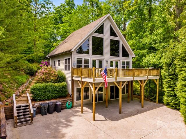 Turnkey mountain retreat just minutes from Asheville, offered as a flexible primary residence, mountain getaway, or income-producing short-term rental. This 3-bedroom, 3-bathroom A-frame-style cabin sits on a private 1.53-acre wooded lot accessed via a private road, with the kind of forest views and seclusion that buyers drive past dozens of listings looking for and rarely find this close to town.  The main level is built for both everyday living and entertaining, with an open living, dining, and kitchen layout under vaulted ceilings that let in abundant natural light and showcase the surrounding tree canopy. Outside, a fire pit area set among the trees offers a natural gathering spot, ideal for evening fires or hosting guests against a backdrop of uninterrupted forest, along with a gas grill for outdoor cooking.  This home has been meticulously maintained and is move-in ready, with a long list of recent mechanical upgrades that take the guesswork out of ownership. A new central HVAC system serves the entire house, with two mini-split units in the basement providing supplemental heat during the winter months. The kitchen and laundry areas feature a new dishwasher and a new washer and dryer. Water quality is addressed by a robust, well-maintained water treatment system paired with a water softener, and a well-maintained Generac generator covering nearly the entire home is included for reliable backup power, a meaningful advantage for a mountain property and a strong selling point for rental guests and owners alike.  A standout feature of this property is the separate basement apartment, accessed independently from the main living space. This flexible layout works equally well as a private suite for extended family and guests, a long-term rental unit, or a secondary short-term rental, effectively giving an owner two income-producing spaces under one roof.  The home has been professionally designed and furnished throughout, and all furnishings, decor, and rental-ready systems and setup convey with the sale, allowing a buyer to step in and operate with minimal startup time or investment. This is a true turnkey opportunity for investors and owner-occupants alike, backed by a property that has clearly been cared for at every level, from its mechanical systems to its interior design.  Fairview offers a rare combination of rural, mountain character and close proximity to Asheville's restaurants, shops, breweries, and cultural attractions. Nearby points of interest include Hickory Nut Gap Farm, area cideries and breweries, the WNC Cheese Trail, and access to Bearwallow Mountain hiking trails, with the Blue Ridge Parkway and downtown Asheville both a short drive away.  Whether the next owner is looking for a personal mountain escape, a multi-generational living setup, or a proven short-term rental asset in one of Western North Carolina's most desirable markets, this property is built to deliver on all fronts. Set on a private 1.53-acre wooded homesite with the privacy of a quiet road, this is mountain living with room to breathe. Schedule a showing to experience this property's privacy, versatility, and income potential in person.