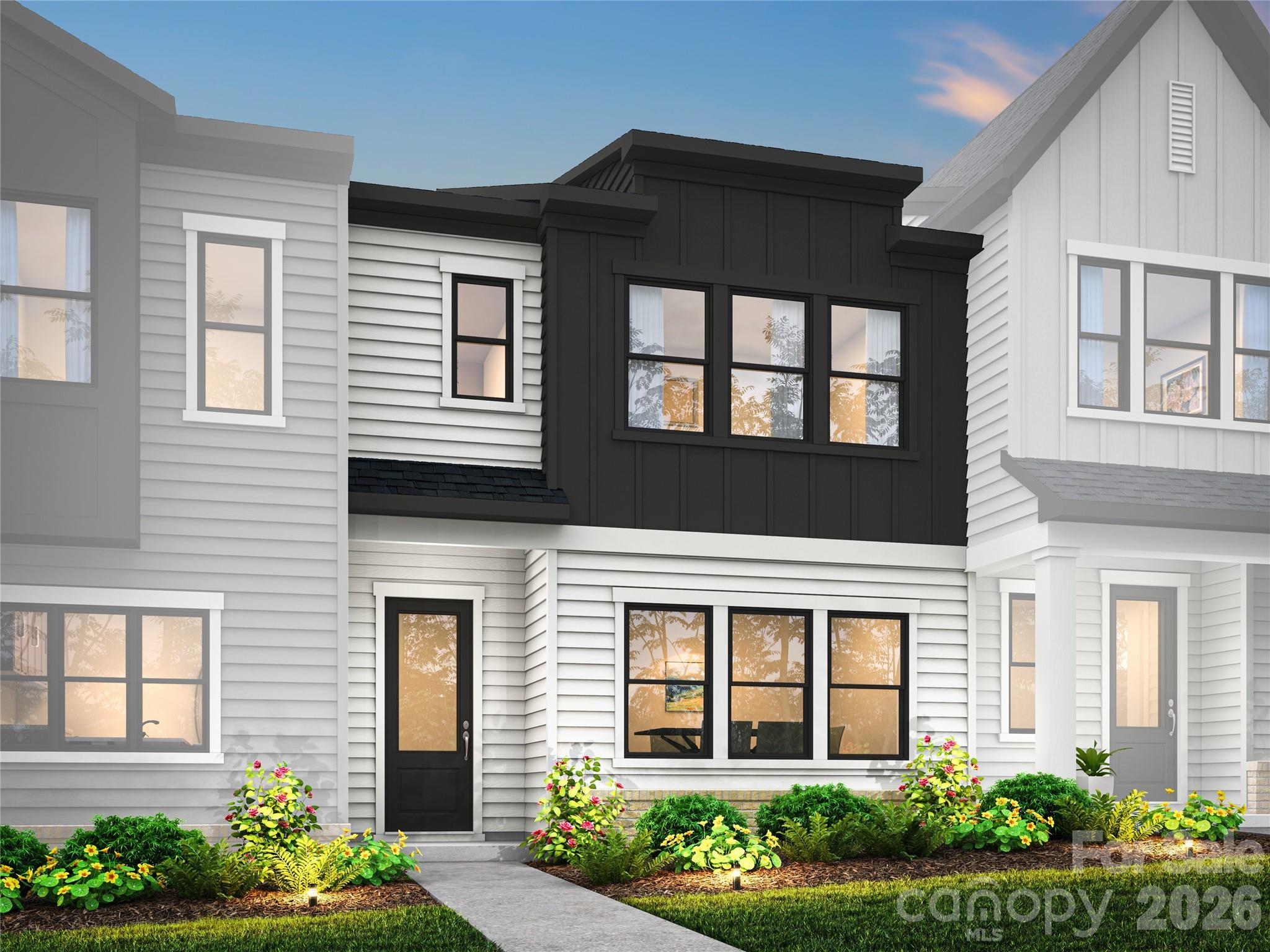 A welcoming streetscape and thoughtful design come together in Grahym at Southbridge in Fort Mill, where comfort, connection, and everyday convenience shape the community experience. The Anne plan at 463 Nash St, with an anticipated August move-in, has been carefully curated with features that elevate both style and function. The gourmet kitchen is designed to be the heart of the home, showcasing dual-tone cabinetry with a contrasting island, warm brown cabinets, white quartz countertops, and a 36" gas cooktop package for a refined yet inviting feel. Oak box stairs with open rails and horizontal metal balusters on the first floor add a modern architectural statement, while a convenient drop zone near the garage helps keep daily routines organized. Upstairs, thoughtful details continue with a laundry room door that connects directly to the primary walk-in closet for seamless flow. The primary suite is designed as a relaxing retreat, featuring warm brown cabinetry, white quartz countertops, and a walk-in shower with tiled walls and a tile floor pan, while the secondary bath includes an additional sink and tiled walls above the tub for added comfort and practicality. Located within top-rated schools and offering easy access to local shops and restaurants, I-77, and Charlotte Douglas International Airport, this home blends intentional design with everyday ease.