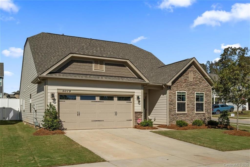 This captivating ranch home located in the desirable Walnut Creek community is good as NEW.  From the beautiful stone and cedar shakes on the outside of the home all the way in to the bright airy open floor-plan, you will fall in love at every turn. This 3 bedroom 2 bath home is trimmed with heavy crown molding, upgraded wide wood plank flooring throughout the main living areas and owner's suite, a designer kitchen with birch white cabinets w/upgraded hardware, granite countertops, stainless steel appliances, gas cooktop, wall oven and a large kitchen island complete with extra storage. The owner's suite includes a trey ceiling, an entry to the back covered patio, his/her under mount sinks in the master bath along with a separate shower and soaking tub, and a large walk in closet. Other upgrades include a laundry room w/sink and cabinetry as well as a drop zone when entering from the garage. This corner lot is complete with a fenced in backyard and well maintained landscaping.