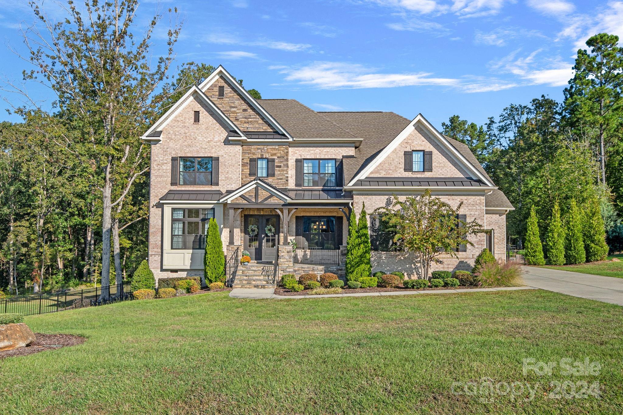 Welcome to your dream home in the Trinity Ridge neighborhood! This stunning all-brick residence sits on a spacious 1.14-acre lot on a cul-de-sac street, featuring a beautifully landscaped garden ready for your green thumb, plus ample open space for outdoor enjoyment. Inside,the home boasts 5 bedrooms and 4 full bathrooms. On the first floor, a bedroom with a full bath offers flexibility—perfect for guests or as an in-law suite. At the heart of the home is a chef’s kitchen, complete with a gas stove, smart appliances, and a double oven. Fresh paint & new carpet throughout the home adds a refreshed, move-in-ready feel. The primary bedroom features a custom closet and an oversized shower.  Additional spaces include a large bonus room & screened-in porch, perfect for entertaining and relaxation. Outside, the 3-car garage with an epoxy floor finish and workbench provide practical utility. An outdoor shower adds a unique touch, ideal for rinsing off after gardening or outdoor fun.