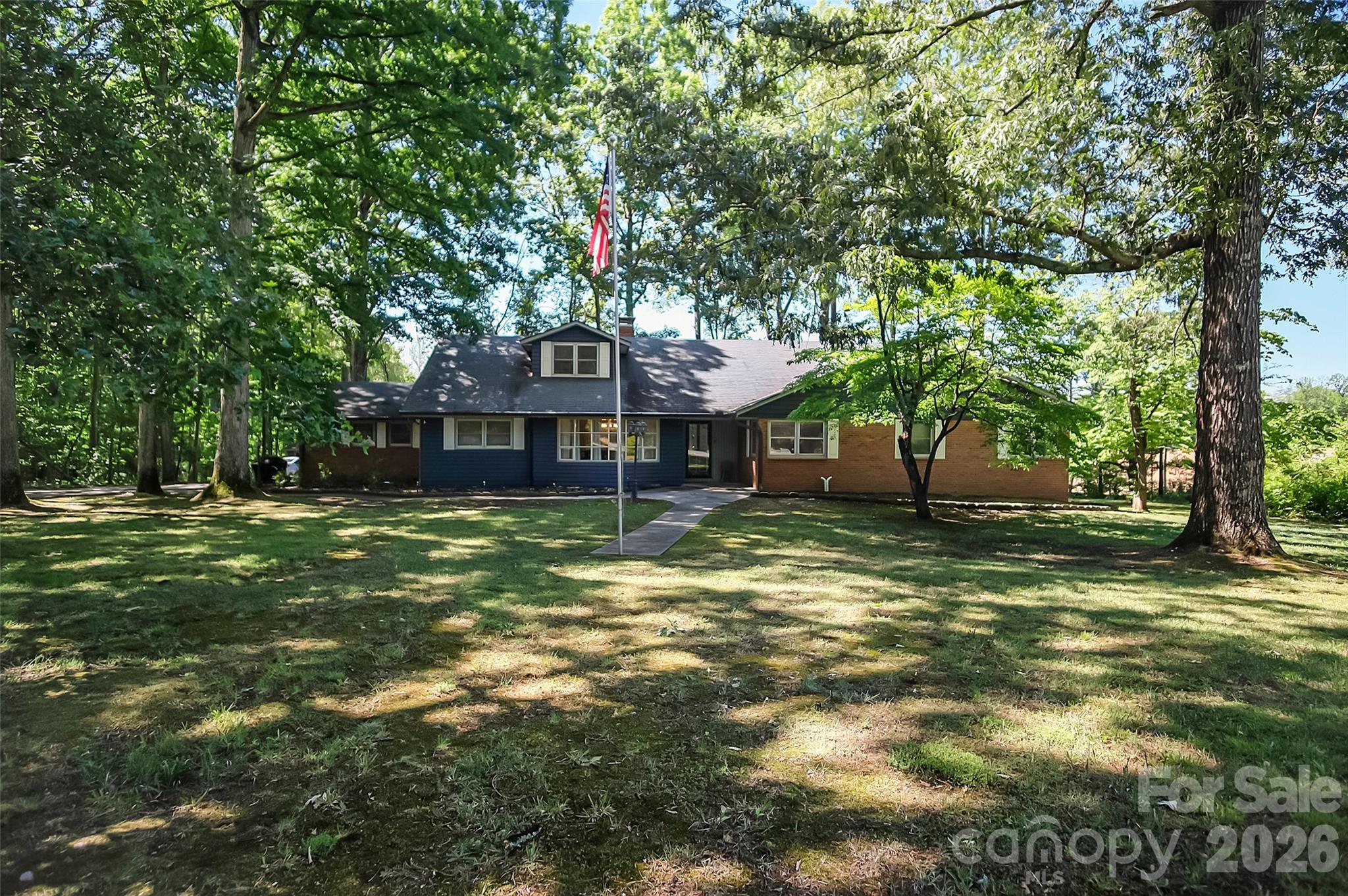 Don’t let the exterior fool you—this Stanley home delivers over 7,000 sqft of usable space, including 4,330 HLA above grade plus a 3,110 sqft partially finished basement packed with potential.

Built in 1971, it’s full of character with touches of vintage charm, highlighted by hand-scraped engineered flooring across the main level and a retro full bath. The main level offers 3 bedrooms, including a spacious primary suite with an updated tile shower, dual vanity, and walk-in cedar closet. The eat-in kitchen features a breakfast bar, double oven, smooth-top range, dishwasher, and abundant cabinet and counter space, with a formal dining room just off the kitchen. Two large living areas—one with a fireplace—and a half bath complete the main floor.

Upstairs includes 3 additional bedrooms, an updated full bath with tile surround, and great hallway storage. The basement adds incredible flexibility with a workshop (garage door access), rec room with fireplace, and extensive storage, plus 220V and gas hookups.

Ideal for multi-generational living or anyone needing room to spread out—this home offers space, function, and opportunity.