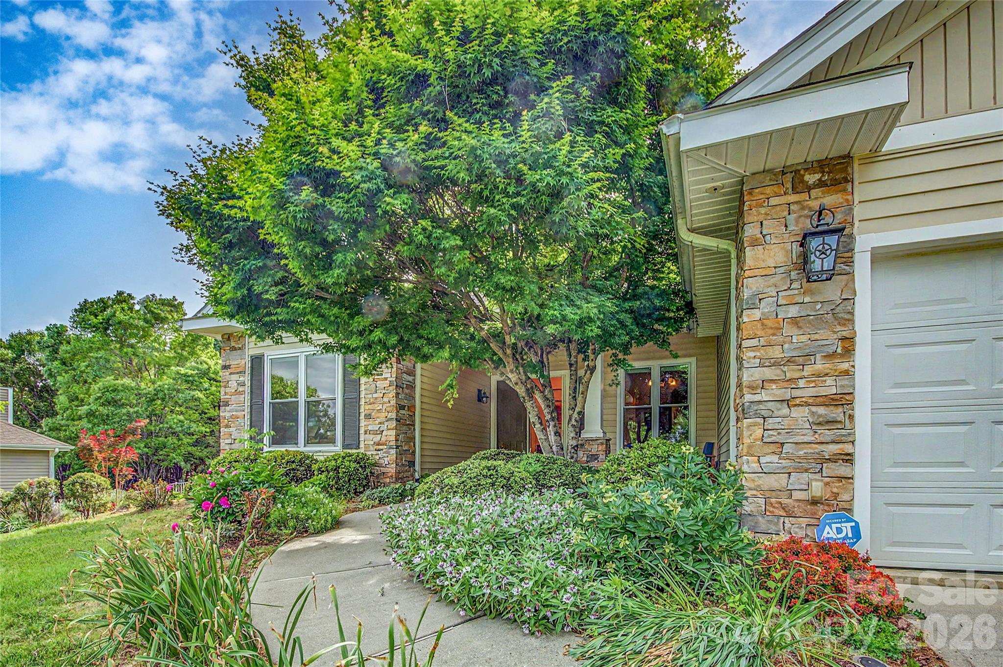 Major Price Improvement! Come see this well-maintained, private, and quiet single-story living home.  Thoughtfully designed with generous and bright living spaces and tall ceilings, this home offers room to relax, entertain, and truly spread out. The oversized primary suite is a standout with its custom bath and an impressive L-shaped walk-in closet.
The tall 10-foot ceilings and large 6-foot tall windows allow for light and views year-round with a window-filled four-season room that lets you enjoy the surrounding gardens and outdoor views year-round.  Paid-off solar panels keep utility costs impressively low, adding long-term value and efficiency. Plenty of space living space to spread out and decorate any way you see fit. 

Conveniently located just minutes from Brevard and Hendersonville, you’ll have easy access to golf, hiking, biking, dining, and shopping. This inviting home blends privacy, space, and smart living.  Come and see all it has to offer.