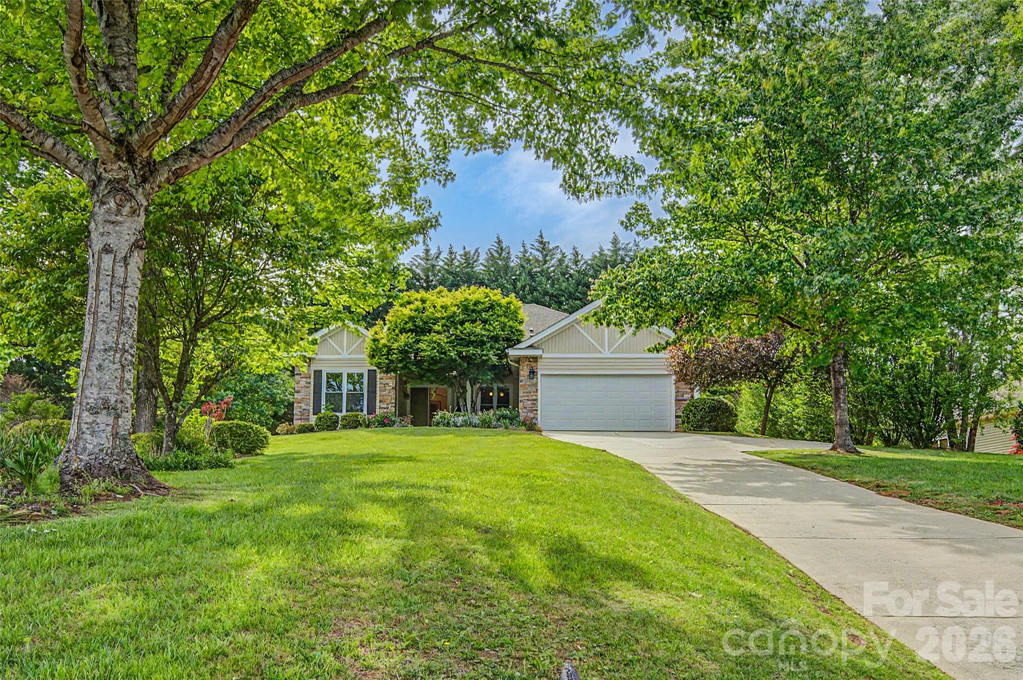 Nestled directly between the quaint town of Hendersonville and the beautiful waterfalls of Brevard.  This one-story home is perched atop a beautiful hill in the wonderful and desirable neighborhood of Eagle Chase. Enjoy the towering 10’ ceiling throughout the house and even in the oversized primary bedroom and oversized custom remodeled bathroom. Don’t spend money on upgrades; this home already has them, from new hardwood floors, remodeled bathroom, upgraded large windows and energy-efficient doors, and so many more. Keep cool with upscale blinds and electric bills of around $30 a month! Located within 4 minutes of a 27-hole golf course, wonderful restaurants, and a grocery store, this home is close to everything. Enjoy this quiet, serene mountain home. See the home you never knew you needed!