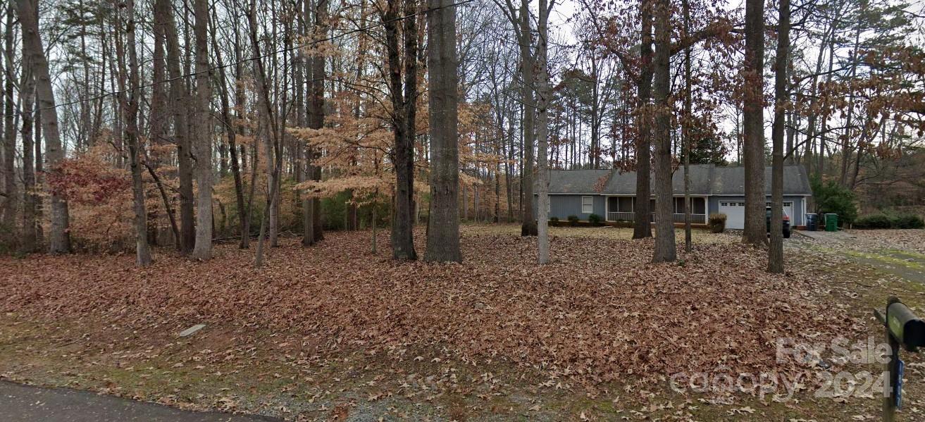 ***Incredible Investment Property Potential*** Renovate and flip or rent. HVAC updated in 2018. Home is conveniently located near I-485 access within a couple of minutes at Moores Chapel Rd interchange.  12 mins to Charlotte Douglas International Airport, 12 mins to outlet stores and upscale shopping, 20 mins to uptown. Large wooded lot with mature hardwoods for shade and undeveloped wooded area beside the property. Seller is selling "AS IS" Bring Offers. Vacant. Schedule through Appt Center.