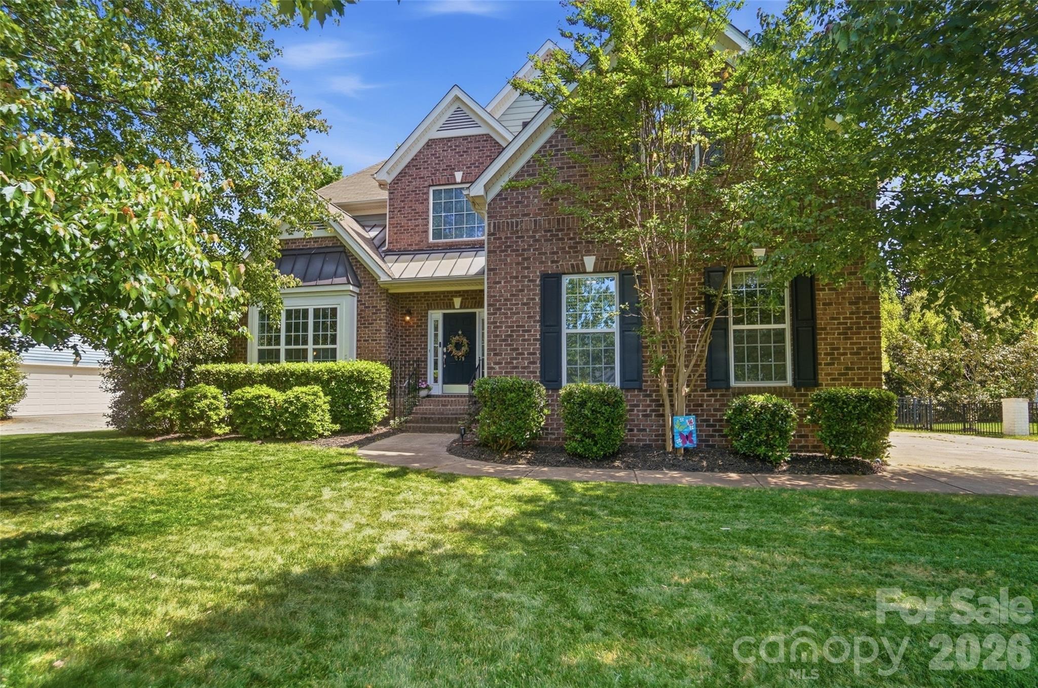 Experience a stunning 2,850+sq. ft. residence where modern updates meet a premier Tega Cay location. Situated just around the corner from the Beach & Swim Center and an extensive trail system, this Lakeshore  home offers unparalleled access to the best of the Tega Cay peninsula community, including highly convenient proximity to Tega Cay Elementary in the high-demand Fort Mill School District.
Move in with total confidence, as nearly every major system and surface has been updated. This bright, open-concept retreat features a beautifully updated kitchen, gorgeous hard-surface flooring throughout the main level, and updated lighting. The primary bedroom and bathroom have also been refreshed for a modern, spa-like feel.
Your mind can be at ease with a new HVAC system (2025), a roof replacement (2012), and an expansive outdoor living area featuring a deck and Sunburst paver patio (2018). The fully fenced yard also offers a private oasis with a hot tub, premium turf and a 5-zone irrigation system. Designed for flexibility, the layout offers four dedicated bedrooms plus a private bonus/office/library that easily serves as a fifth bedroom.