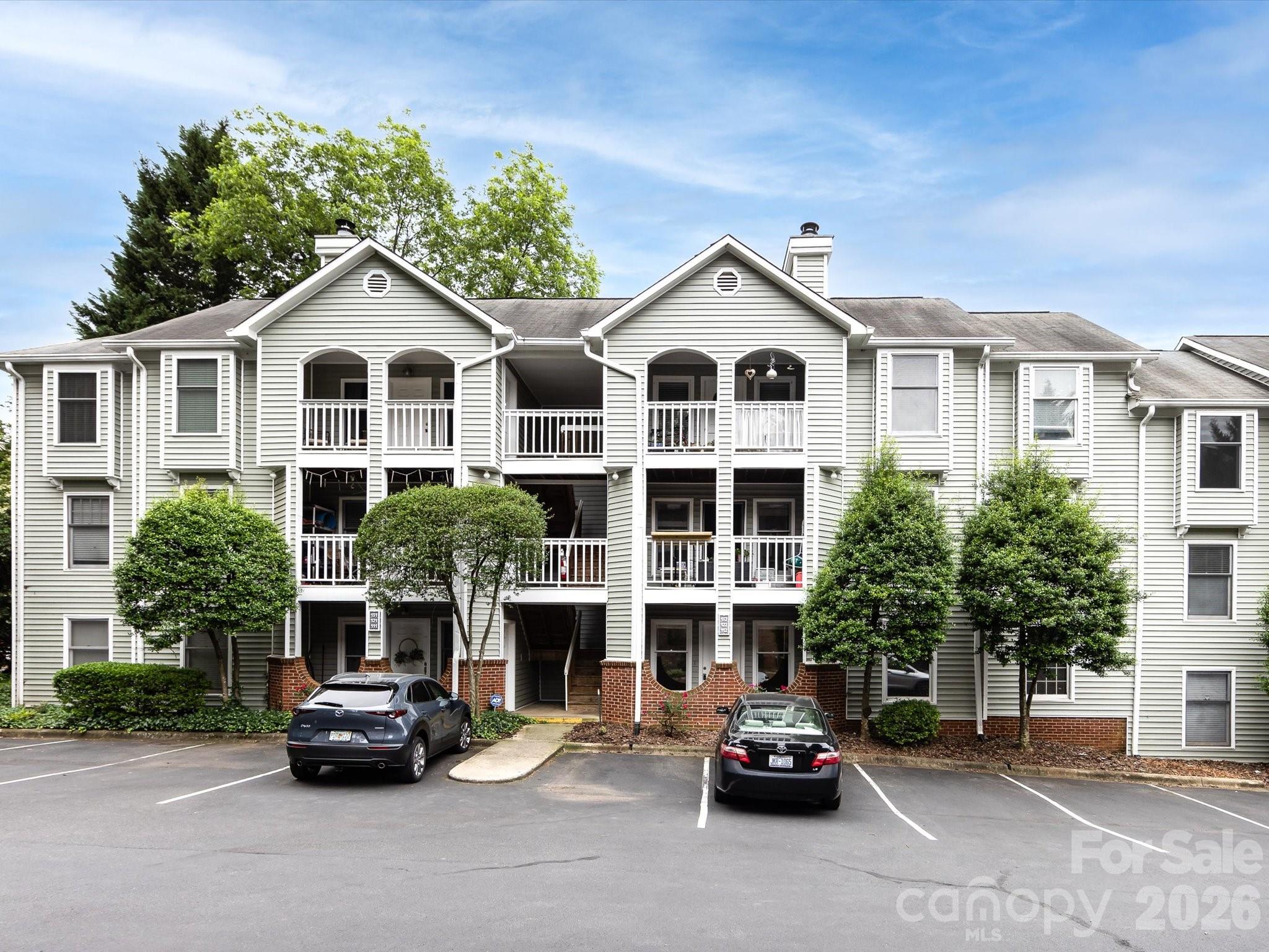 GREAT INVESTMENT OR PURCHASE OPPORTUNITY! Myers Park Condo in fabulous location! Beautiful views from the 2nd floor unit. Covered front porch perfect for relaxing or entertaining. Open floor plan with all new LVP Flooring. Family Room with fireplace and coat closet. Large breakfast area with built-in bookshelves. Kitchen with granite countertops, new stainless steel sink and dishwasher, electric range/oven. Refrigerator and microwave stay with the home. Primary bedroom with En Suite full bath and walk-in closet with custom shelving. Bedroom 2 with large closet. Full second bathroom. Laundry Room with Washer and Dryer that will convey. New paint 2025, New bedroom fans 2025, New hardware/lighting/mirrors in both bathrooms 2025. HVAC 2023. Community pool.