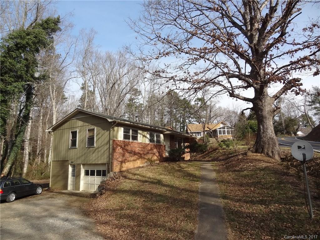 This Ranch Home in Haw Creek, in great condition, sits on a beautiful private lot with a majestic 200 year old oak tree. The .43 acre lot allows for a large garden area along the creek in the private back yard. The home has hardwood oak floors throughout, a new kitchen with granite counters, and a recent heat pump with AC. There is a full daylight basement with drive-in access.  This home and great community is located just 5 minutes east of Downtown Asheville.