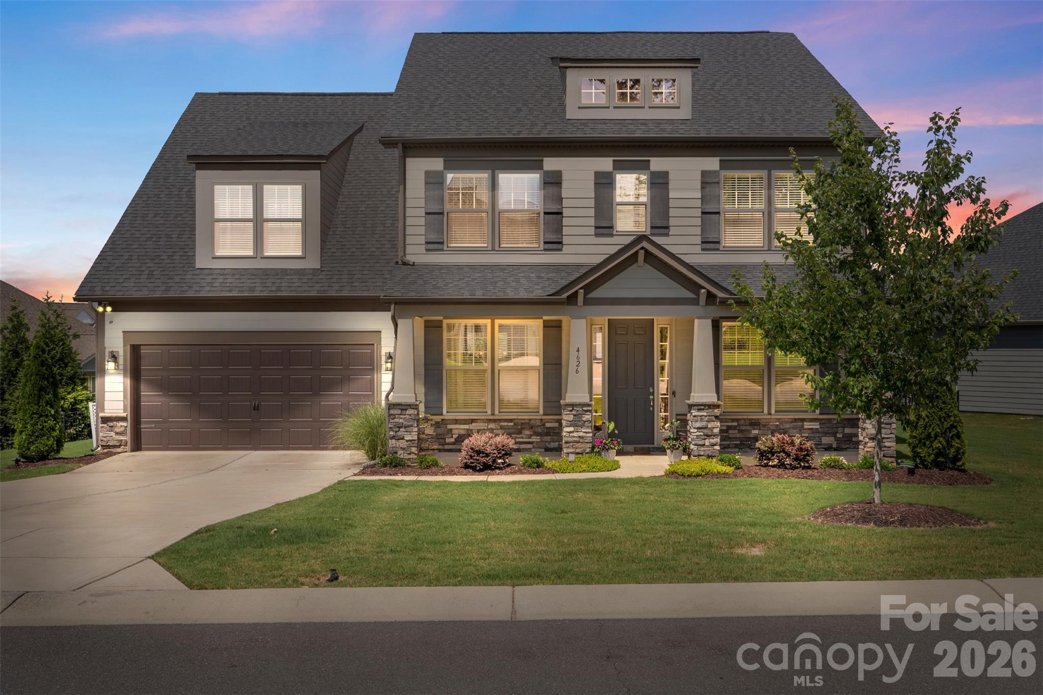 Welcome to this stunning finished home featuring 5 bedrooms and 4.5 baths. The spacious floor plan includes a guest suite with private bath on the main level, along with a dedicated study and formal dining room. The gourmet kitchen opens to a breakfast area and large family room with fireplace. Upstairs you'll find the luxurious Owner’s Suite, three additional bedrooms, and a versatile bonus room. The fully fenced backyard with oversized patio provides the perfect space for entertaining. Ideally located between Fort Mill and Ballantyne, with easy access to top schools, shopping, and dining.