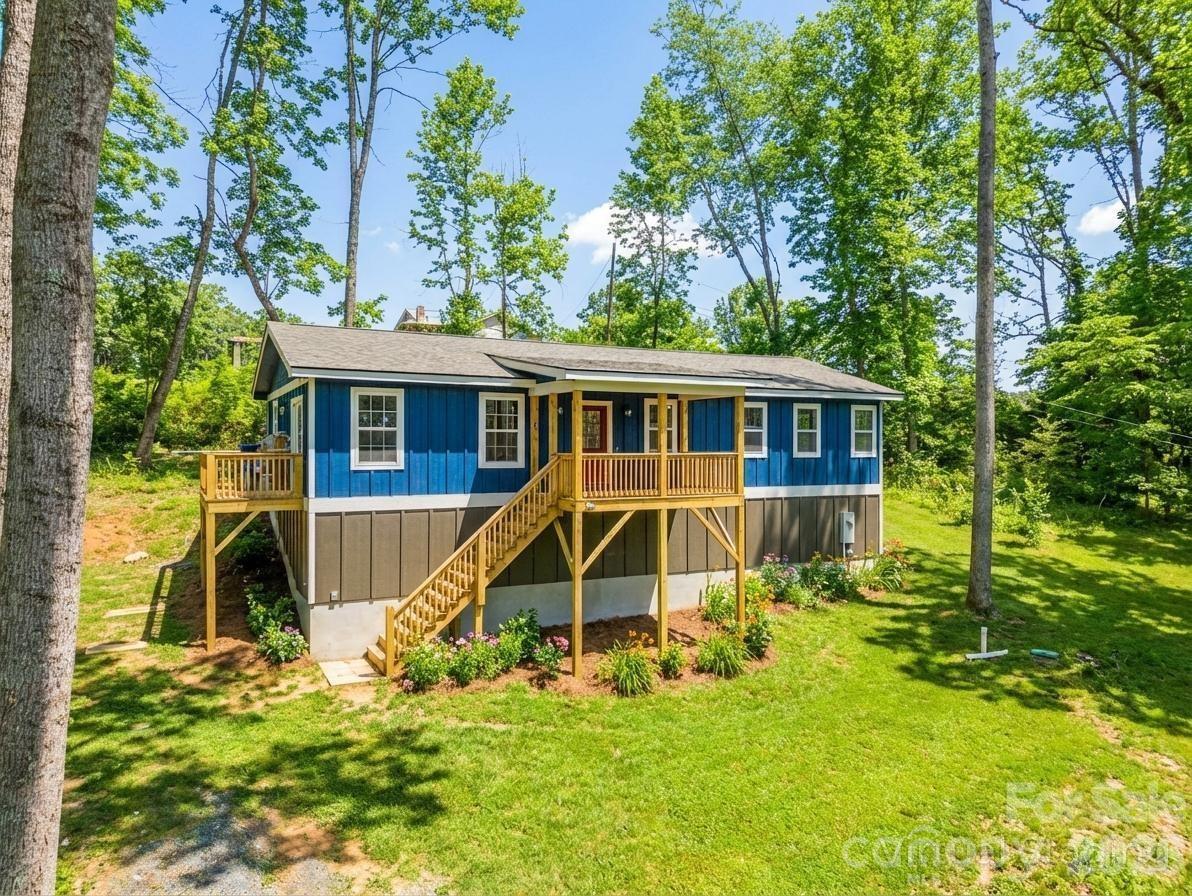 Discover the perfect blend of quality, comfort, and location with these brand-new homes in Rosman, NC. Ideally situated near some of Western North Carolina’s most sought-after outdoor destinations, you’ll be just minutes from Pisgah National Forest, DuPont State Forest, Gorges State Park, and the Headwaters area—offering endless hiking, mountain biking, and waterfall adventures. Each thoughtfully designed home features an open floor plan with granite countertops, spacious living areas, and three large bedrooms with two full baths. Enjoy outdoor living with a generous covered front porch and a rear deck overlooking over an acre of land. Built with attention to detail and quality throughout, these homes offer modern finishes, durable construction, and move-in-ready convenience. Whether you're looking for a full-time residence or a mountain getaway, this location and layout are hard to beat. Driveway is now getting final coat of gravel three asphalt but the builder can pave it for a small fee.