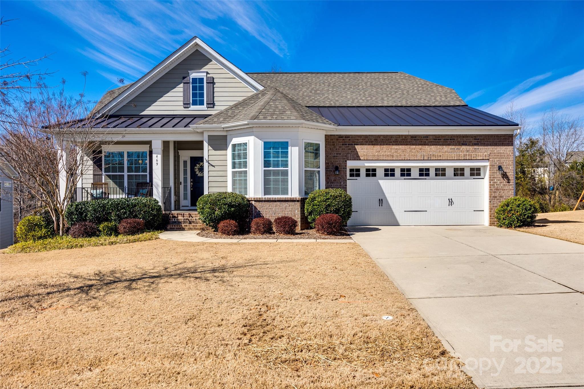 Located in the desirable Hawk's Creek community. This two-story ranch design provides ample room for both relaxation and entertainment. The main level includes a welcoming foyer, formal dining room, generously sized living room with a fireplace that flows seamlessly into the kitchen. The kitchen is equipped with modern appliances, gas range, abundant cabinetry and a central island, ideal for culinary enthusiasts. The upper level houses the primary suite, complete with a spacious en-suite, walk-in closet, dual vanities, soaking tub, and separate shower. This floor also has a 2nd bedroom with full bath. The second floor offers two additional well proportioned bedrooms, full bath, work out/flex area, storage, office, and second living room equipped with a fireplace. Entertain on the spacious deck or relax under the retractable awning. Situated on a well-maintained lot, that includes outdoor space suitable for various activities.  This home is convenient to schools, amenities, and more.