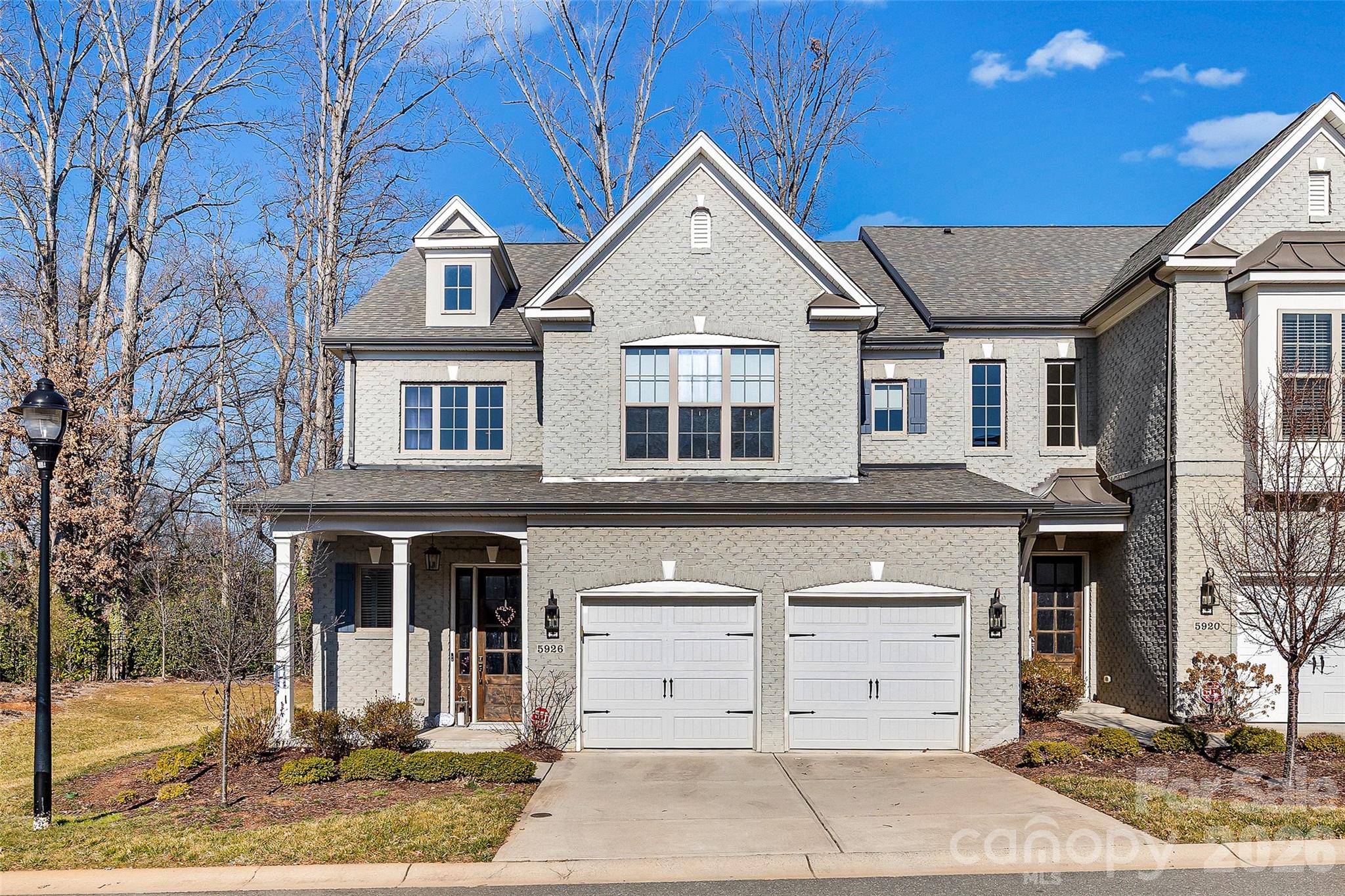 Beautiful, bright, and exceptionally quiet end-unit townhome with painted brick exterior and a rare private side and rear yard. Surrounded by trees and featuring a covered back porch, this home offers the privacy and feel of a single-family residence with the ease of low-maintenance townhome living. The porch is enhanced with motorized screens, allowing you to comfortably enjoy the outdoor space with added privacy and protection.
The main level features 10-foot ceilings, heavy crown molding, thick baseboards, and abundant hardwood floors. The spacious Great Room includes a stone fireplace, built-in media cabinetry, and integrated speakers. The kitchen is thoughtfully designed with stacked-to-the-ceiling cabinetry, a large quartz island with apron-front sink, stainless steel appliances, 36-inch gas cooktop, wall oven, and built-in microwave/convection oven.
The first-floor Owner’s Suite offers hardwood floors and a tray ceiling, creating a comfortable and private retreat. The Owner’s Bath includes a large tiled shower, double-sink vanity, and a walk-in closet with built-in shelving. A first-floor laundry room adds everyday convenience.
Upstairs, 9-foot ceilings and a generously sized Rec Room with hardwood floors provide flexible space for guests, hobbies, or additional living areas. Tile flooring is featured in all full baths and the laundry room.
Located just minutes from Quail Corners and Southpark shopping and dining, this home combines convenience with a peaceful setting. HOA dues include all exterior maintenance, irrigation water and landscape lighting, allowing for easy living and beautifully maintained surroundings.
An ideal option for those looking to downsize while maintaining space, quality finishes, and privacy.