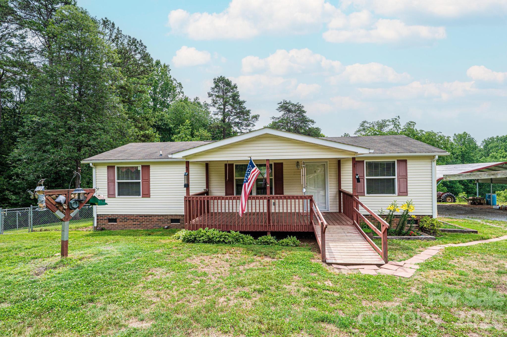 Escape to the privacy and tranquility of country living with this well-maintained 2014 manufactured home situated on approximately 5.65 acres. Offering 2 bedrooms and 2 full bathrooms, this property provides a comfortable layout with plenty of room to enjoy both inside and out. Step outside to find a fenced backyard, offering additional outdoor space and flexibility for a variety of uses. A detached workshop provides an ideal area for hobbies, projects, or equipment storage, while an additional outbuilding offers even more storage options.