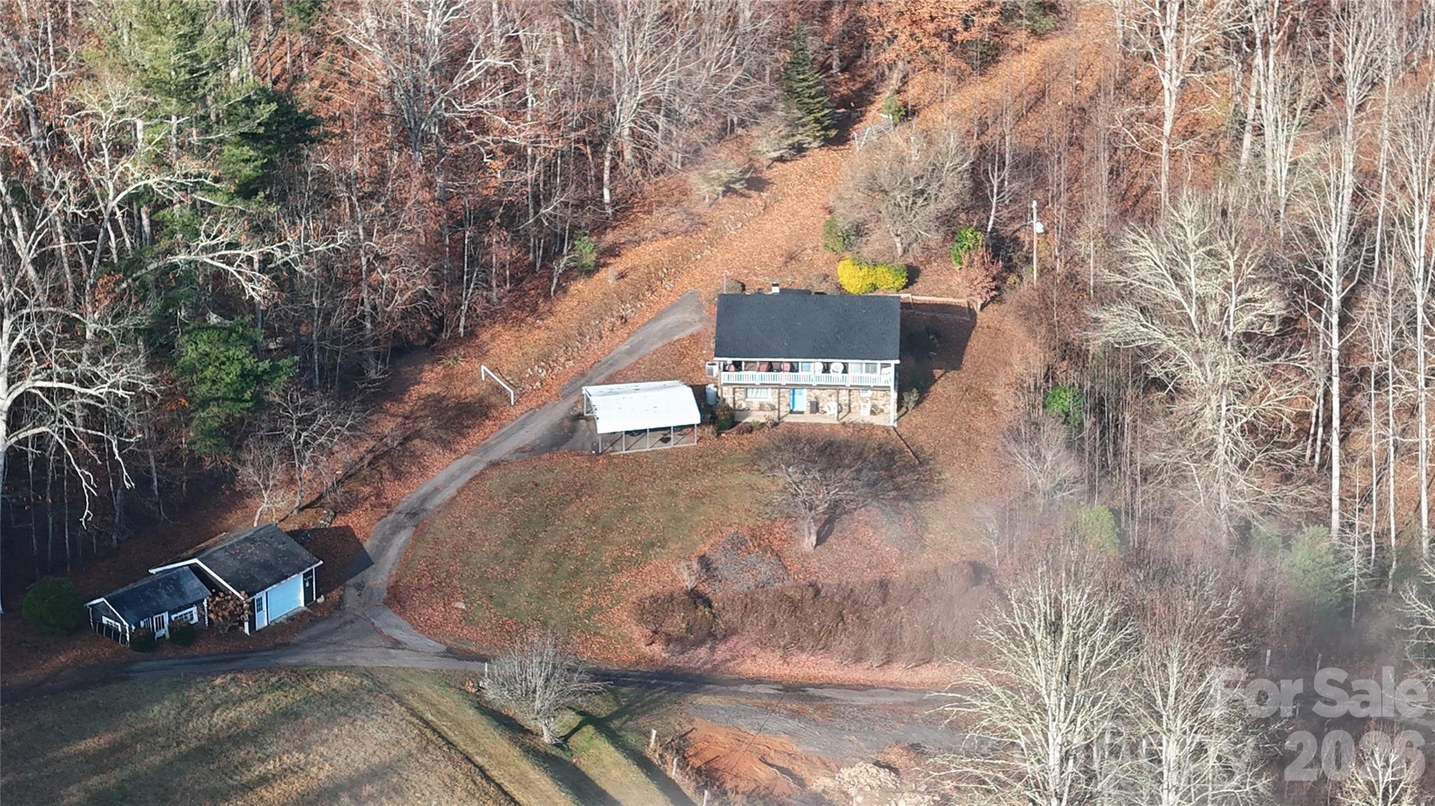 BACK ON THE MARKET THROUGH NO FAULT OF THE PROPERTY! The previous buyer's job transfer unexpectedly fell through, creating a second opportunity to own this exceptional mountain retreat. To help ensure a smooth transaction, a brand-new survey has already been completed, allowing for a quicker and more efficient closing process.

Welcome to 15.59 acres of unrestricted mountain property offering privacy, usable land, and endless potential in the heart of Burnsville. This unique property combines a comfortable home with the kind of acreage that is becoming increasingly difficult to find, especially with this level of accessibility and versatility. Tucked into a peaceful setting, the property provides a rare opportunity to enjoy both seclusion and convenience while being surrounded by the natural beauty of Western North Carolina.

The home features 3 bedrooms and 1.5 baths with a functional layout and inviting living spaces, making it ideal for full-time living, a mountain getaway, or an income-producing rental. The interior offers a warm and comfortable atmosphere with plenty of opportunity to make it your own.

The owners have taken excellent care of the home and completed numerous updates, making it move-in ready. Major improvements include a new roof installed in 2021, an updated heat pump in 2021, a new well pump and filtration system, a convenient spout providing access to natural spring water, and a new hot water heater installed in 2023.

The land is where this property truly shines. Featuring multiple areas of usable terrain, established logging roads, and excellent accessibility throughout, the property lends itself to a variety of uses. Whether you're exploring future homesites, riding ATVs, creating trails, or simply enjoying the peaceful surroundings, you'll appreciate the versatility and usability of the acreage.

This property is perfectly suited for a homestead, mini farm, private mountain retreat, recreational property, or multi-generational estate. With no restrictions, the possibilities are wide open. Build additional homes, add guest cabins, bring animals, create gardens, establish income-producing opportunities, or simply enjoy the freedom and privacy that unrestricted land provides.

Conveniently located while still offering a true sense of seclusion, you'll enjoy peaceful mountain living with easy access to Burnsville's shops, restaurants, outdoor recreation, and community amenities.

Properties offering this combination of unrestricted acreage, updated home, established road systems, usable land, and mountain privacy are becoming increasingly rare. Don't miss your second chance to own this remarkable Western North Carolina property.