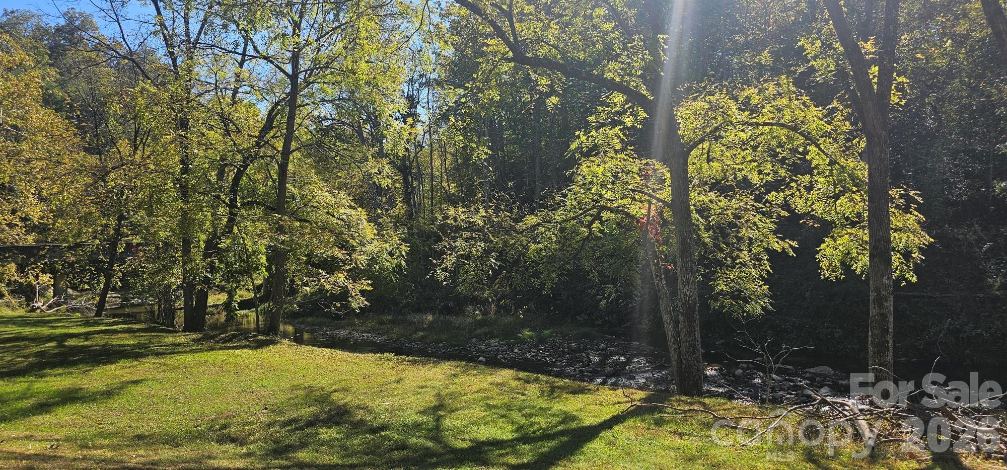 PRICE IMPROVEMENT!  MOTIVATED SELLER - Nestled in a quiet subdivision on the beautiful Buncombe and Madison County line, this property offers the perfect setting for your mountain retreat. The gently sloping terrain is ideal for building a primary residence or second home, providing both privacy and natural beauty. Located within a gated community with paved access throughout the development, the neighborhood offers convenience while maintaining a peaceful mountain atmosphere. Residents and their guests enjoy a versatile community barn used for gatherings and events, along with a charming free-flowing creek—perfect for relaxing summer evenings and watching the fireflies.

Come experience the tranquility, natural beauty, and welcoming community that make this mountain property the perfect place to build your getaway.