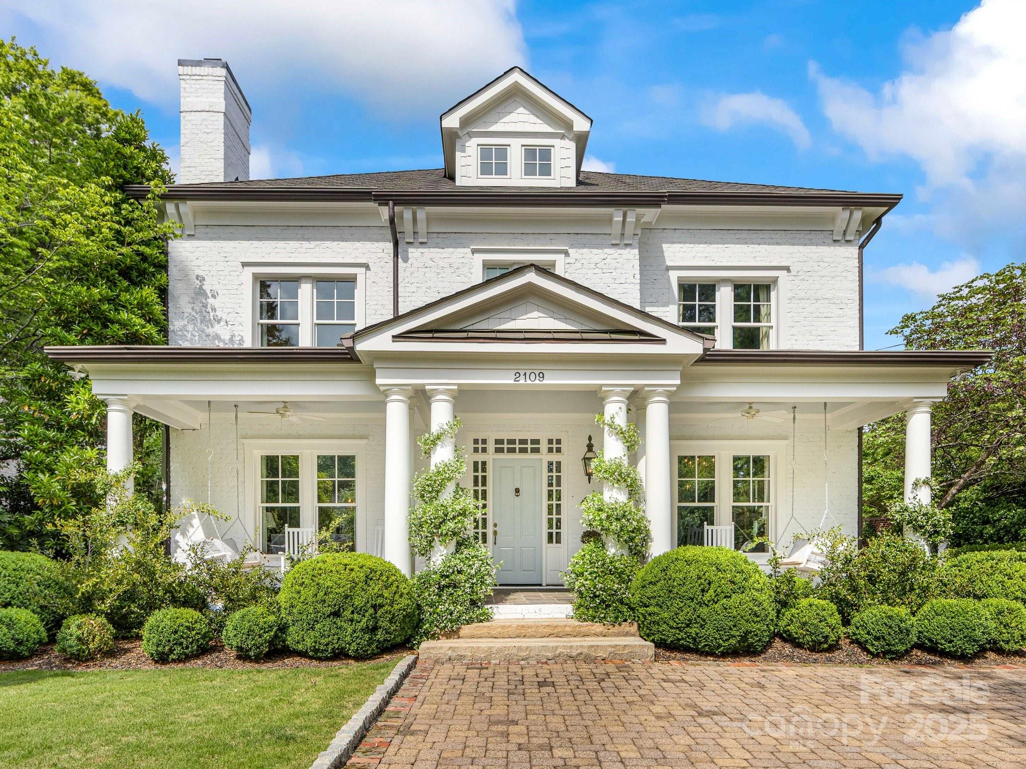 Exquisite custom-built Myers Park home masterfully combines modern amenities, luxury finishes, and timeless elegance. Reclaimed brick, detailed architectural moldings, and deep Southern porches provide historic character to this modern home. Soaring 10’ ceilings and modern layout make the home grand and welcoming. Chef's kitchen is a showstopper with Calacatta Gold marble countertops, custom built-in china cabinet, Wolf range, Miele dishwasher and paneled beverage drawers. Schumacher wallpaper and Waterworks, Lefroy Brooks, & Rohl fixtures. Expansive paneled family room open to kitchen, perfect for entertaining. Luxurious primary suite with private terrace, spa-like bathroom, and two large walk-in closets. Finished lower level offers room for home gym, playroom, and storage. Detached two-car garage with guest house. Private backyard features beautiful pergola covered patio with stone fireplace and grill, surrounded by manicured landscaping. A true sanctuary in the heart of Myers Park.