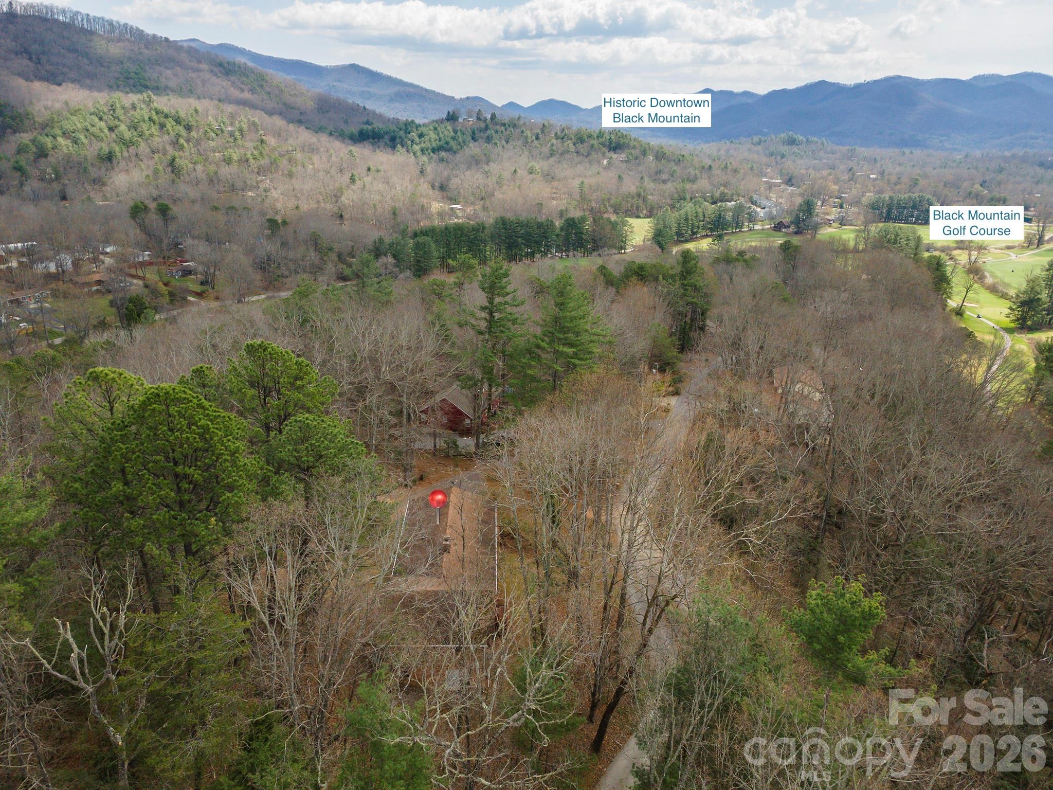 Unlock serious potential with this 4-bedroom, 3-bathroom single-family home tucked away on a peaceful dead-end road adjacent to the Black Mountain Golf Course. This property offers charming vintage touches, and a desirable location with beautiful winter views. Plenty of space for projects in the oversized garage/workshop. The downstairs rec room is ready to host games, movie night, or set up a home gym. Enjoy the rare combination of privacy and proximity to town — with no through traffic, fairway views, and Lake Tomahawk Park just steps away. Black Mountain's charm, outdoor recreation, and proximity to Asheville only sweeten the deal.