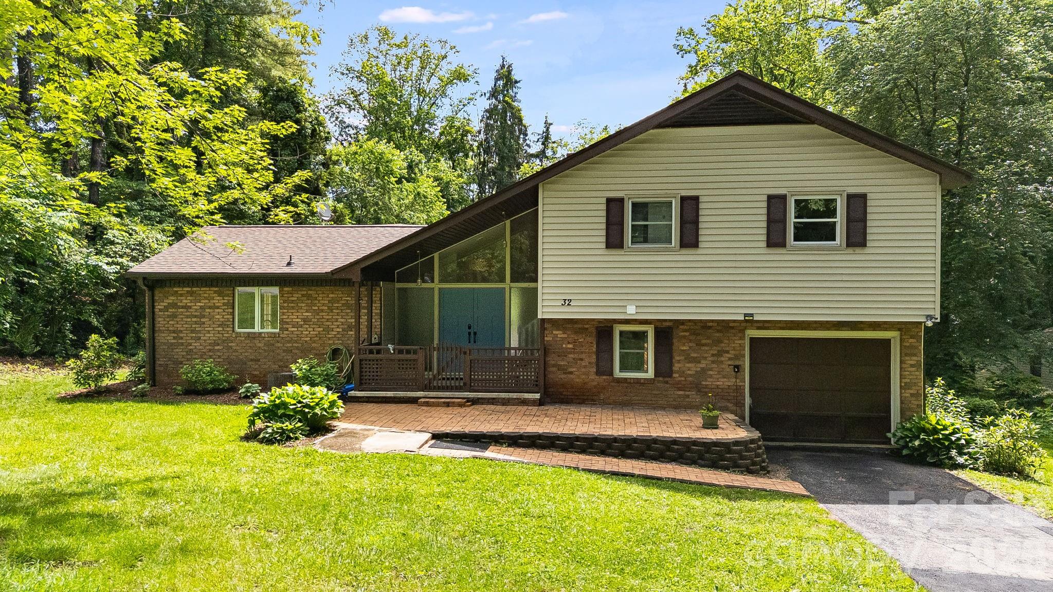 Welcome home to this charming split-level residence, thoughtfully designed for comfortable living and creating lasting memories. The spacious family kitchen offers plenty of room for gatherings, celebrations, and everyday moments, while the bright and inviting open floor plan provides the perfect place to relax and enjoy natural light year-round. Ideally located near local schools, community activities, and the neighborhood park, this home makes it easy to stay connected and involved. Enjoy peaceful walks with friends through the quiet neighborhood, bike rides along safe streets, and the beauty of a welcoming community. The inviting front porch is the perfect spot to unwind while taking in the sights and sounds of the neighborhood. Outside, the large level yard offers endless possibilities, from vibrant flower gardens and bird feeders that attract colorful visitors to a wonderful space for entertaining family and friends. Whether hosting special occasions or enjoying a quiet afternoon outdoors, this property provides the perfect setting to make yourself at home. Adding even more value and potential, the property includes a large detached garage/workshop and a separate tiny home, both with power already connected. These versatile spaces are ready for your vision and personal touch to restore them to their full potential. Whether you're dreaming of a workshop, hobby space, guest accommodations, home office, or creative studio, the opportunities are endless.
