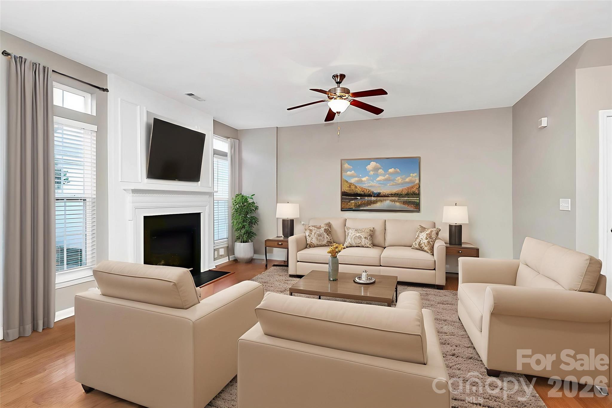 Beautiful 3-bedroom, 2.5-bath townhome with a 2-car garage in a prime Huntersville location close to everything the area has to offer. Recent updates include whole home painted including ceiling and new carpet installed, brand new floors 2026! The main level features a spacious dining room with tray ceilings, hardwood floors throughout, a large open kitchen, and a cozy fireplace in the living room—perfect for cool evenings. Upstairs you’ll find three generously sized bedrooms with LVP flooring and ample storage and two full baths. Step outside to enjoy the private patio and fenced backyard. Conveniently located near I-77, I-485, Birkdale shopping, restaurants, and grocery stores.