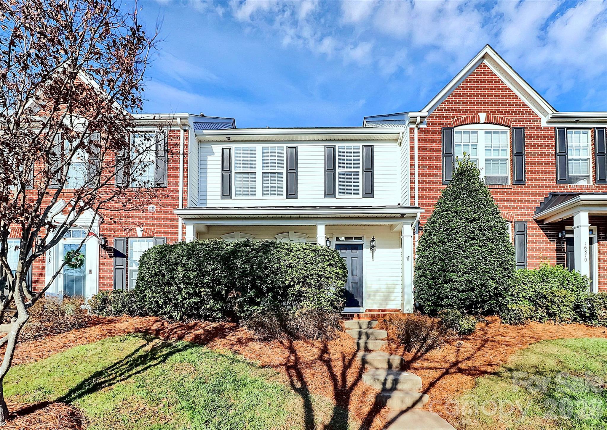 Beautiful 3-bedroom, 2.5-bath townhome with a 2-car garage in a prime Huntersville location close to everything the area has to offer. Recent updates include whole home painted including ceiling and new carpet installed! The main level features a spacious dining room with tray ceilings, hardwood floors throughout, a large open kitchen, and a cozy fireplace in the living room—perfect for cool evenings. Upstairs you’ll find three generously sized bedrooms with LVP flooring and ample storage and two full baths. Step outside to enjoy the private patio and fenced backyard. Conveniently located near I-77, I-485, Birkdale shopping, restaurants, and grocery stores.
