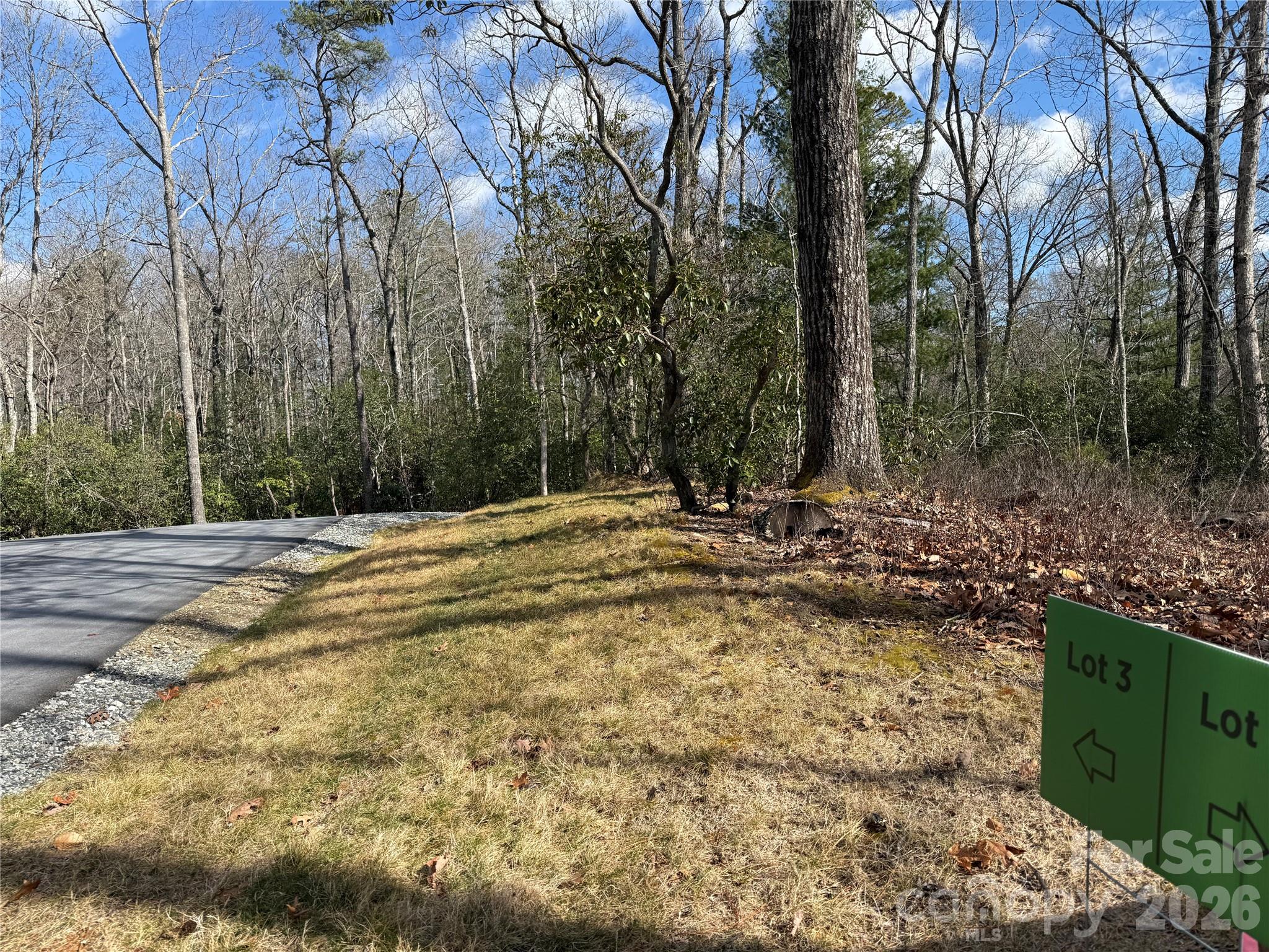 Welcome to a rare micro-neighborhood opportunity in the heart of Western North Carolina. Conveniently located between Hendersonville, Mills River, and Brevard this thoughtfully planned community features five oversized homesites perched along a gentle ridge, offering the perfect blend of privacy, natural beauty, and everyday convenience. Each lot enjoys excellent year-round sunlight. Mature hardwoods and native flora create a stunning canvas on which to bring your personal dream to life on. Generous lot sizes provide ample space to design your custom home with ample outdoor living areas, all with a peaceful sense of seclusion.
Easy-to-navigate roads make access simple and practical, ideal for year-round living or a mountain retreat. The topography is gently sloping offering flexible building sites without the steep grades often found in the mountains Located just minutes from the world-renowned trails, waterfalls, and outdoor adventures of Pisgah National Forest, this property places hiking, biking, fishing, and scenic drives right at your doorstep. Enjoy the serenity of a private mountain setting without sacrificing proximity to recreation and amenities. Build community with friends and neighbors at a shared shelter and firepit, and hike or bike from your backdoor on the ~1 mile neighborhood trail.