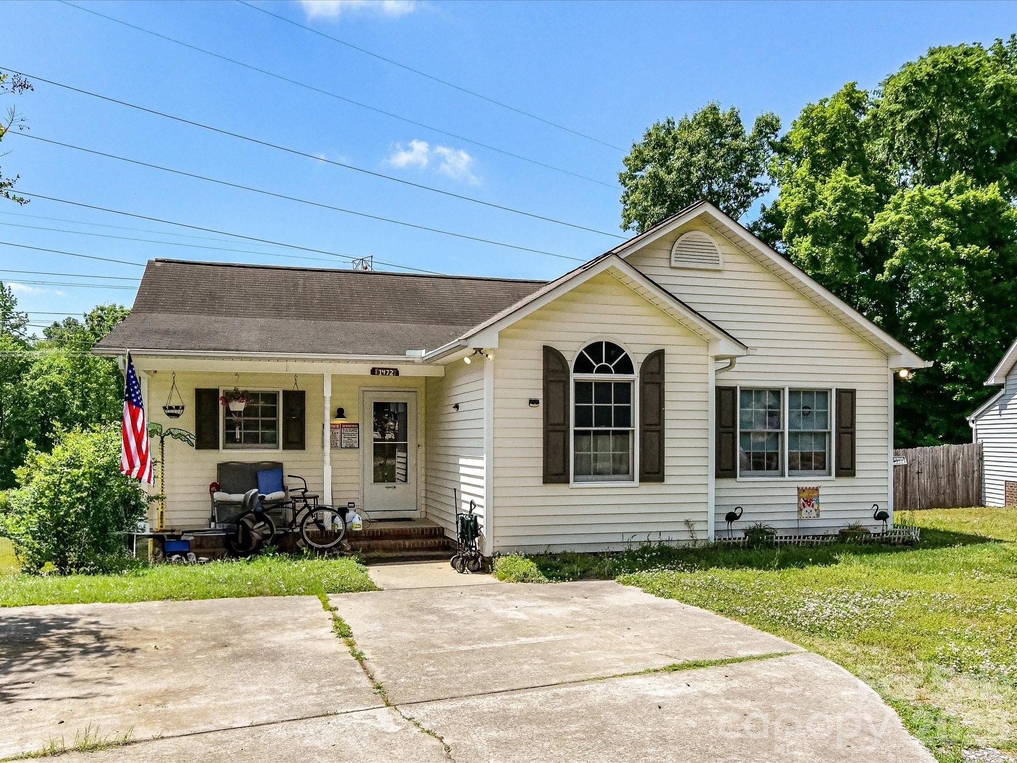 Welcome home to this charming 3-bedroom, 2-bath home.  Vaulted ceilings create an open, airy feel throughout the main living area and bedrooms, while the cozy fireplace adds warmth and character to the living room. The kitchen features granite countertops and plenty of space for cooking and gathering. Step outside to relax on the covered back deck overlooking the large backyard—perfect for entertaining, pets, play, or simply enjoying the outdoors.