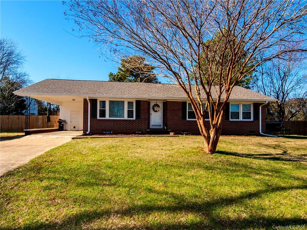 Do not miss this adorable house! Beautiful brick home on a corner lot with 3 bedrooms and 1.5 baths. This darling home was renovated a few years ago including: kitchen and bathrooms, vinyl siding at carport, all soffits, roof, 4 year old HVAC system including the furnace & A/C, and new windows. Plus a huge fenced in yard and storage building. Kitchen has cherry cabinets with soft close drawers and gorgeous granite plus a butcher block movable island. Custom cut carpet rugs remain.
