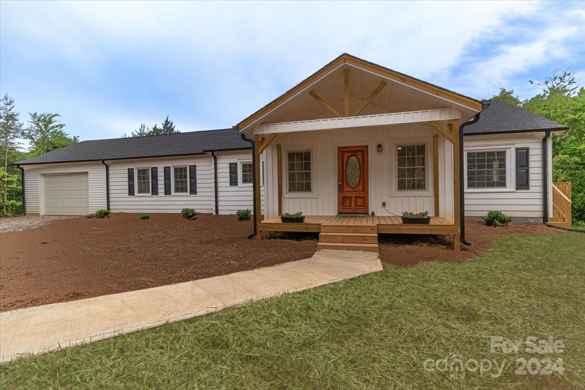 Nestled on over 5 sprawling acres, this completely updated ranch home is the perfect mixture of modern and comfortable living! Everything is new including the roof, siding, plumbing, electric, HVAC, foundation and landscape. Inside, you'll find a sleek kitchen with new granite countertops and new appliances that opens up to the large dining area. The living area shines with durable tile flooring, while the bedrooms are cozy with plush carpeting. Outside, the covered deck is perfect for grilling and relaxing while overlooking a spacious backyard for those furry friends to run and play. Surrounded by trees, this home offers privacy without any HOA rules. It's a peaceful retreat where nature meets modern comfort.