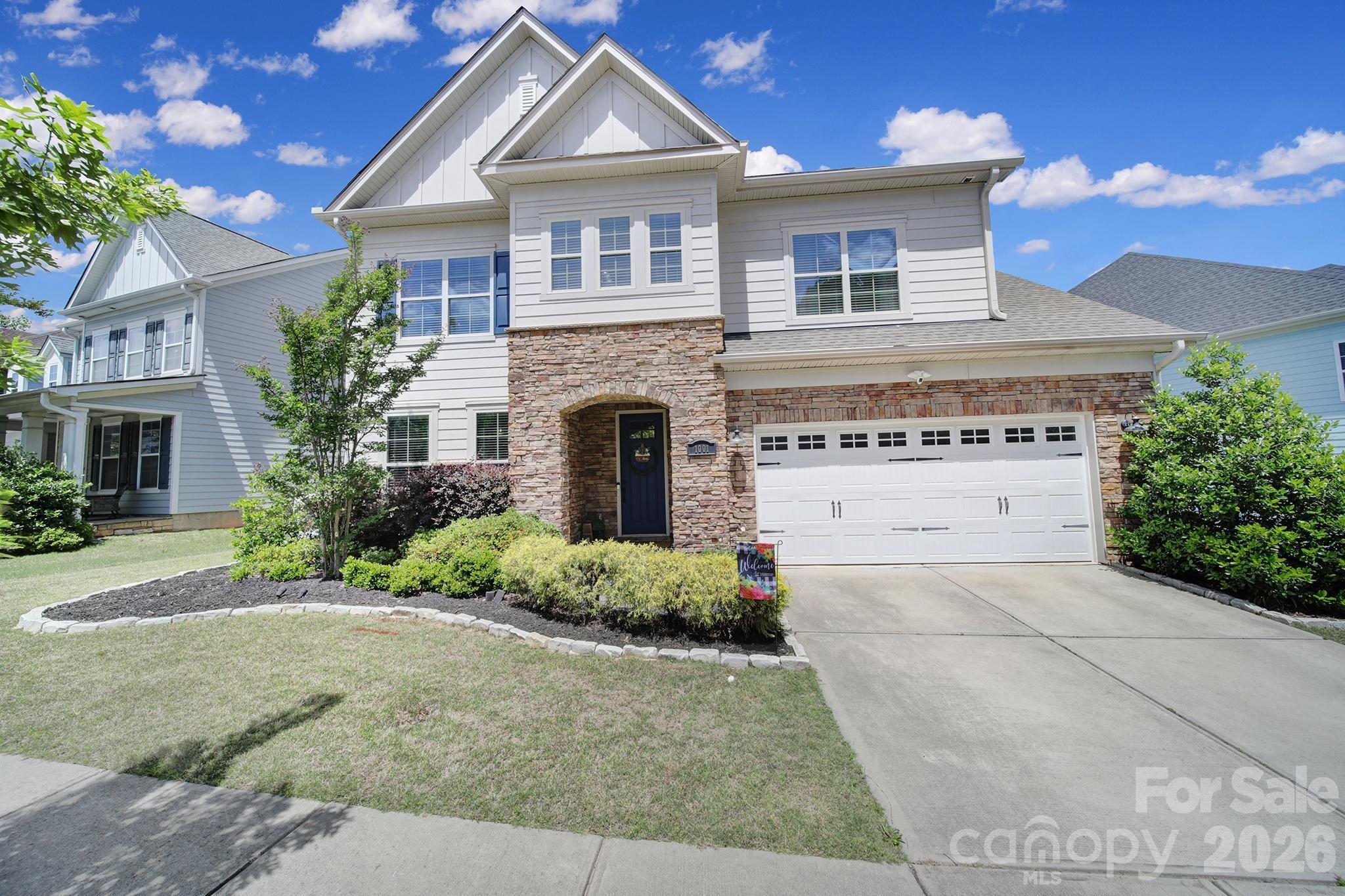 This beautiful open-concept home is filled with natural light, highlighting a gourmet kitchen featuring an oversized granite island w ample seating, gas cooktop, stainless steel appliances, walk-in pantry, and an open dining area that flows seamlessly to the screened-in porch and deck—perfect for outdoor living. The main level showcases upgraded 5” hardwood floors, a private office with French doors, a spacious great room with built-in bookshelves and cabinetry surrounding a cozy gas fireplace, a guest bedroom with a full bath, and a two-car garage. Upstairs, the luxurious primary suite offers an oversized shower and custom walk-in closet. Two additional bedrooms, a full bath, a generous loft space, and a convenient laundry room complete the second level. The community features include clubhouse, pool, 2 playgrounds, 2 ponds, walking trails, & walkable dining options—all within the award-winning Fort Mill school district. Welcome home!