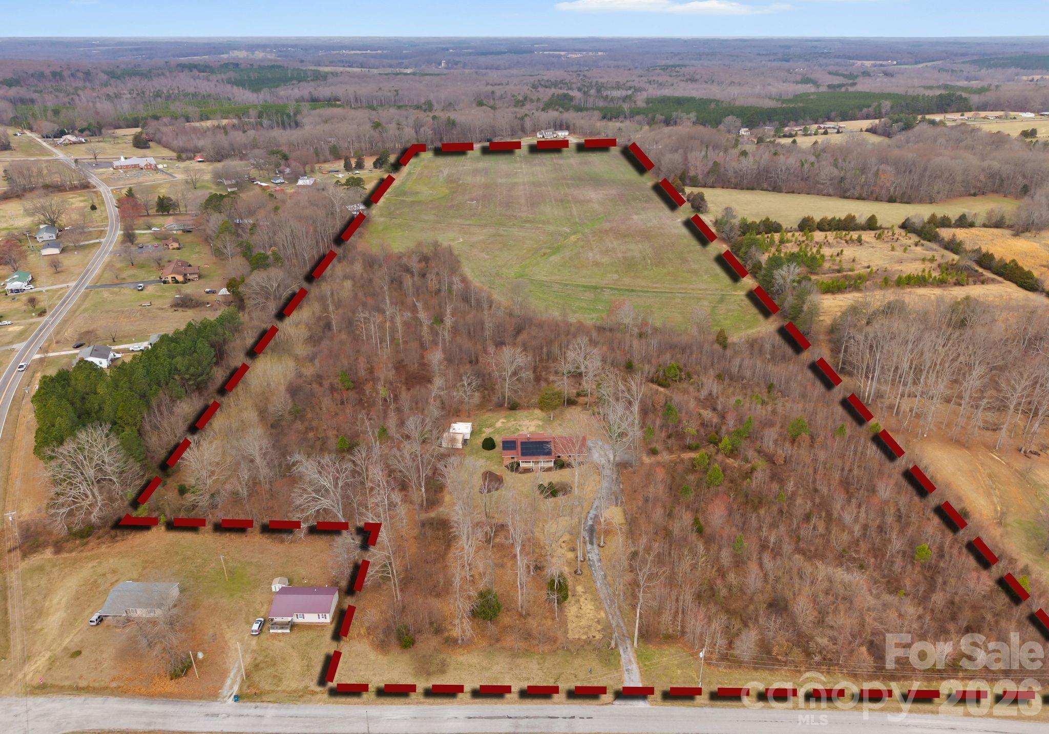 Welcome to your own private slice of the countryside. This charming 3-bedroom, 3-bath brick ranch home, built in 1985, sits on 41.2 acres of beautiful farmland, offering privacy, space, and endless possibilities. A private driveway leads you into a quiet, serene setting where nature takes center stage. The home offers a functional ranch-style layout, a 2-car attached garage, and recently remodeled bathrooms that bring added comfort and convenience. Key improvements have already been completed, including a new roof and solar panels in 2020, HVAC system replacement in 2024, and a new water heater in 2025, allowing for low-maintenance living and added peace of mind. Step outside and enjoy the abundant wildlife, including frequent deer sightings, making this an ideal retreat for nature lovers, hunters, or anyone seeking a peaceful rural lifestyle. The expansive acreage offers ample space for farm animals, farming, recreation, or simply soaking in wide-open views and fresh country air.