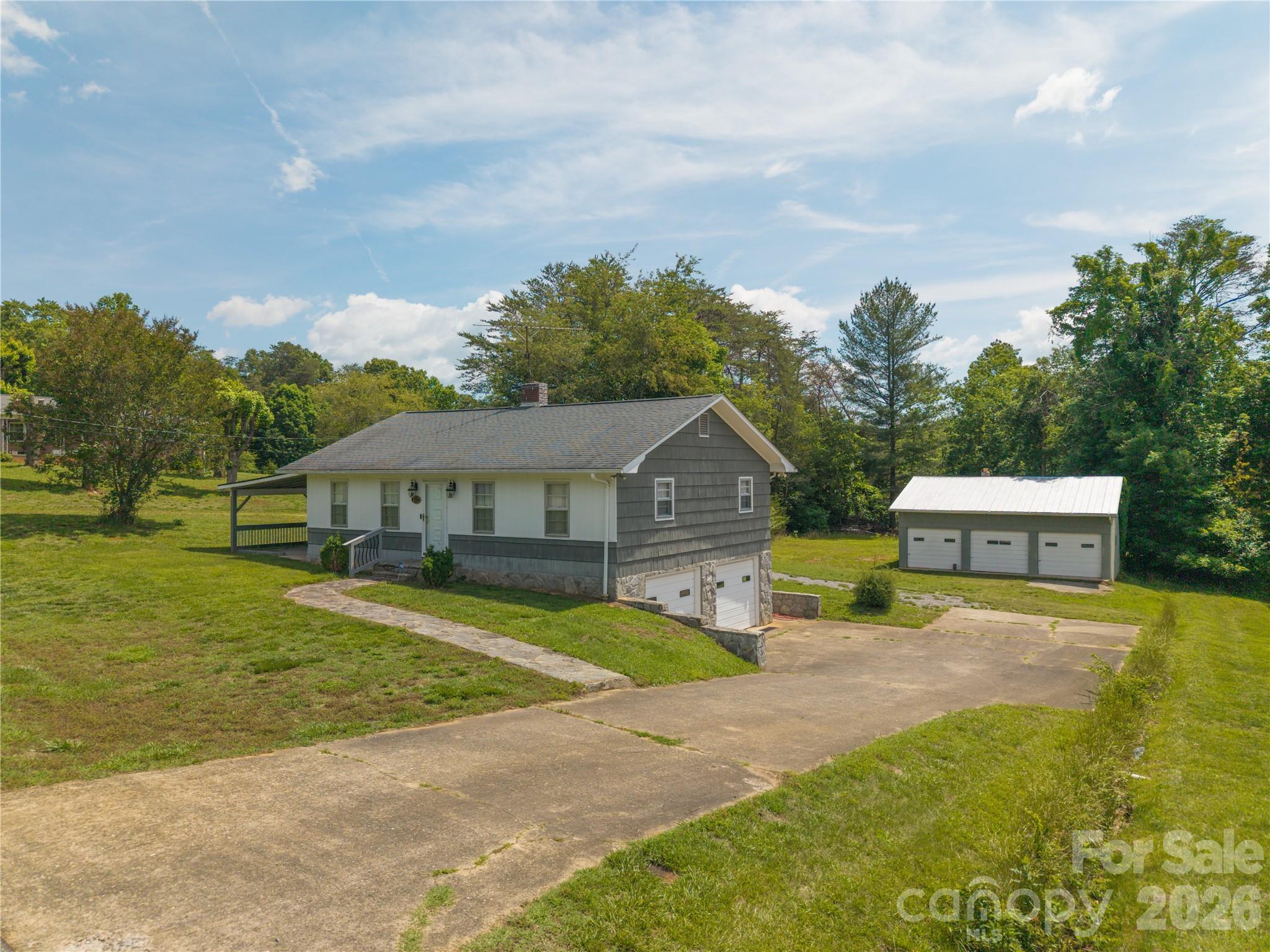 This well-maintained 3-bedroom, 1-bath home offers comfortable one-level living on .77 acres. Whether you're looking for your first home, downsizing, or seeking a property with exceptional workshop and storage space, this one checks all the boxes. Inside, you'll find a functional floor plan with inviting living spaces and plenty of natural light. Outside is where this property truly shines. The approximately 800-square-foot detached 3-bay garage provides endless possibilities for car enthusiasts, hobbyists, small business owners, boat storage, motorcycles, woodworking, or a dream workshop.
The surrounding yard offers room to garden, entertain, or simply enjoy the peaceful setting, while still being conveniently located just minutes from downtown Morganton, shopping, dining, and recreation.