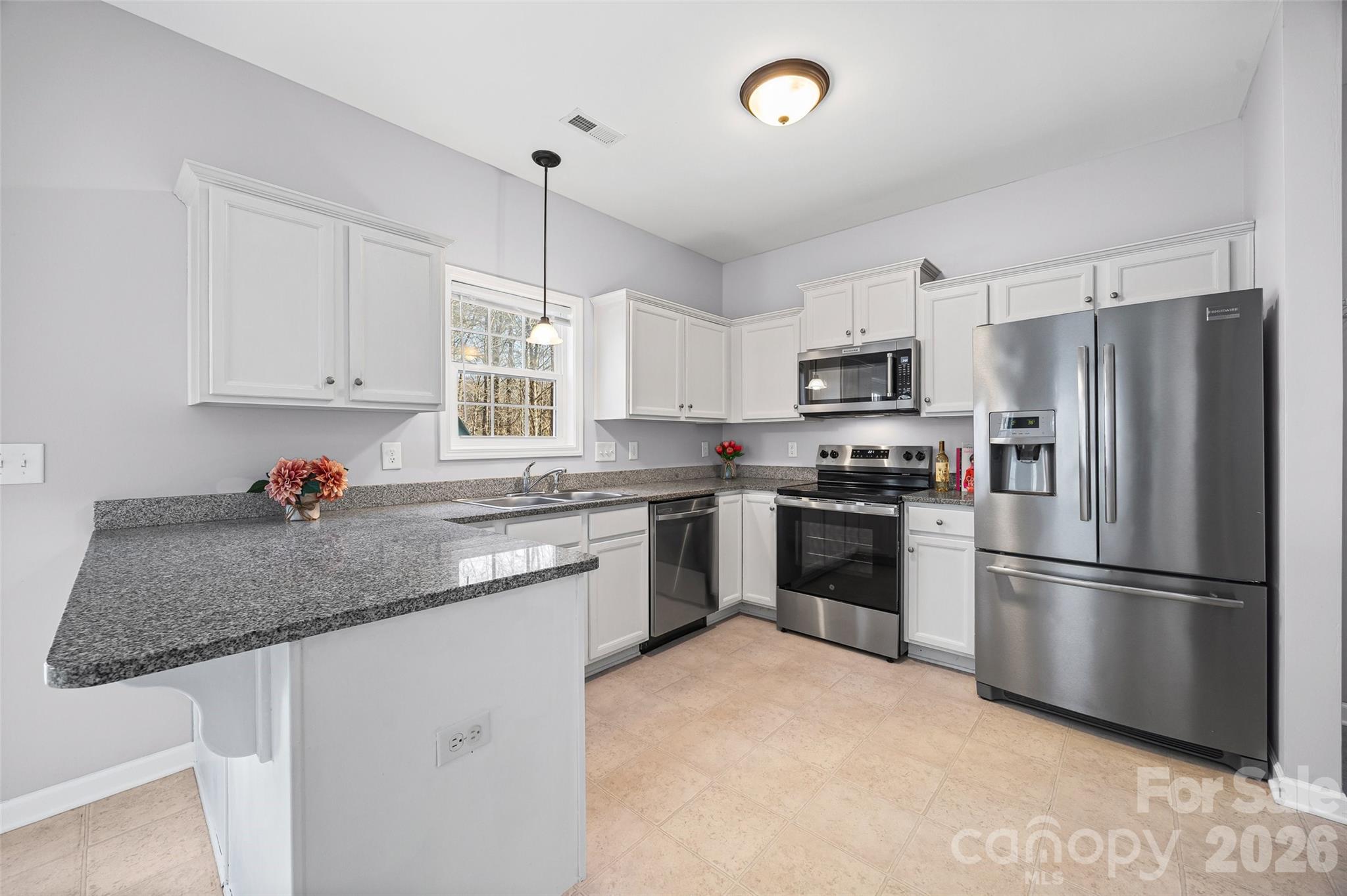 Welcome to this move-in ready Fort Mill home with NO HOA, a fenced backyard, and an unbeatable location near Downtown Fort Mill, Indian Land, Ballantyne, and Anne Springs Close Greenway! This beautifully maintained 3-bedroom, 2.5-bathroom single-family home with a one-car garage offers the perfect combination of comfort, convenience, and flexibility in one of the Charlotte area’s most desirable locations. Step inside to discover an inviting layout with 9-foot ceilings, abundant natural light, and stylish finishes throughout. The living room creates the ideal setting for relaxing evenings, entertaining guests, or everyday living. The kitchen is designed with both function and style in mind, featuring granite countertops, a breakfast bar, ample cabinet space, and updated stainless appliances including a new oven and microwave (2025) plus dishwasher (2023). Upstairs, the oversized primary suite offers a peaceful retreat with vaulted ceilings, a private en-suite bathroom, and generous closet space. Two additional bedrooms provide flexibility for guest rooms, a home office, fitness space, or growing household needs. Enjoy outdoor living year-round in the fully fenced backyard — perfect for pets, cookouts, gardening, or quiet evenings under the stars. With NO HOA restrictions, you’ll enjoy added freedom rarely found in this highly sought-after Fort Mill location. Conveniently located just minutes from shopping, dining, entertainment, parks, and top commuter routes, this home is also only 15 minutes from The Bowl at Ballantyne and close to the outdoor recreation, trails, and events at Anne Springs Close Greenway. If you’re searching for a home in Fort Mill with no HOA, granite countertops, updated appliances, fenced yard, and easy access to Ballantyne and Indian Land, this home is a must-see.