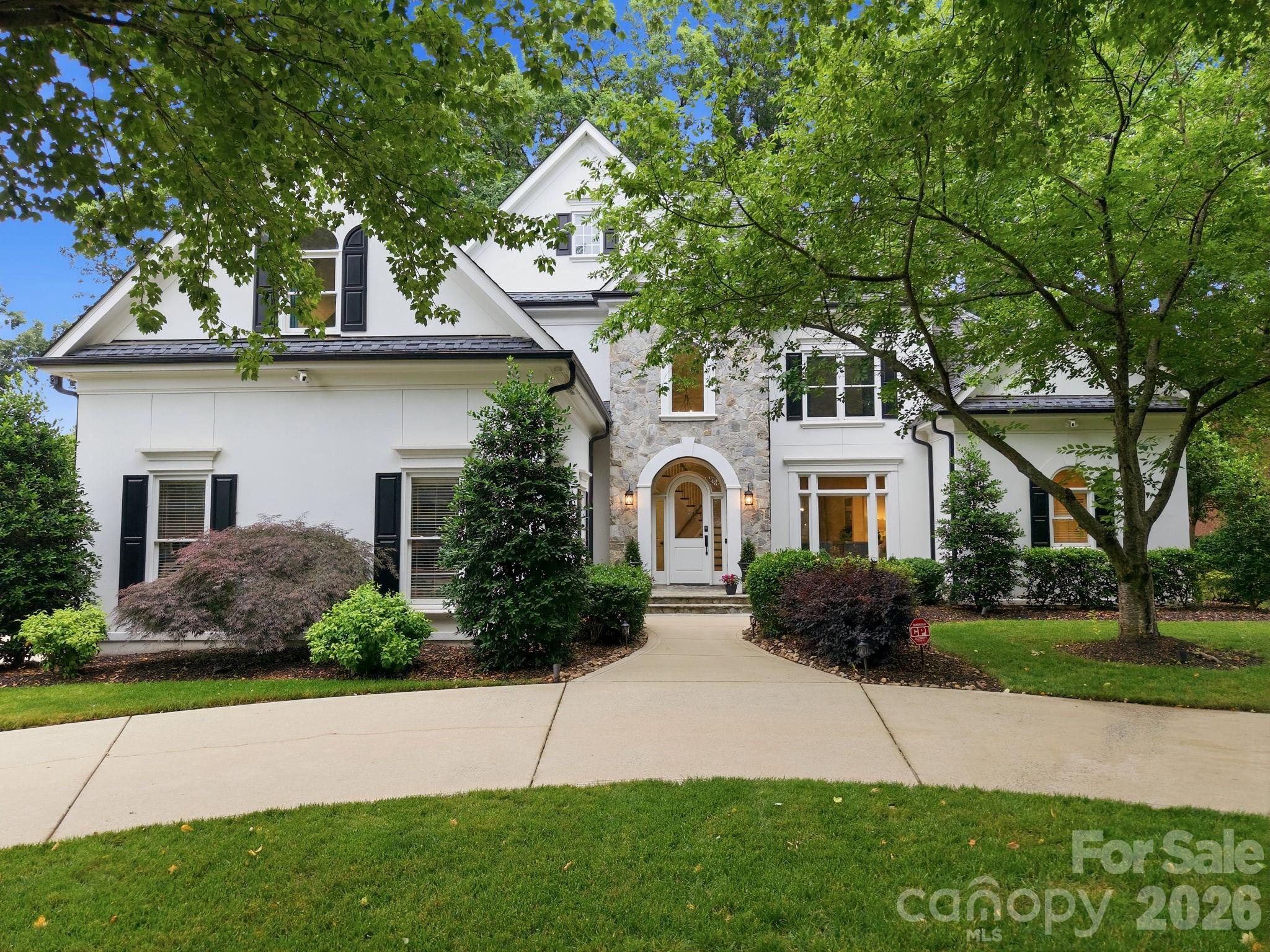 Welcome to 18620 Town Harbour, a beautifully updated luxury residence located in the highly desirable Peninsula Country Club neighborhood. This property offers refined living, timeless design and elevated finishes throughout.  This exceptional home features a stunning chef’s kitchen appointed with luxury appliances. The kitchen seamlessly flows into the main living spaces that include a large gathering room and an inviting enclosed porch designed for year-round enjoyment. The spacious main-level primary suite serves as a private respite  including a luxury spa like bath and expansive walk in closet. There are four additional bedrooms and a bonus room in the upper level, providing ample space for muti-generational living and guests. Thoughtfully designed for both comfort and convenience, the home also includes an  updated elevator that allows access to all three floors of the home including expansive third floor storage. The park like back lawn and  living area includes  lush green landscaping, a fire pit, putting green, hot tub and space for a pool. This amazingly curated rear living area creates a serene setting for entertaining or relaxing. Combining luxury, functionality, and an exceptional location, this Peninsula property offers an outstanding lifestyle in one of Lake Norman’s most sought-after communities. This home is simply perfect.