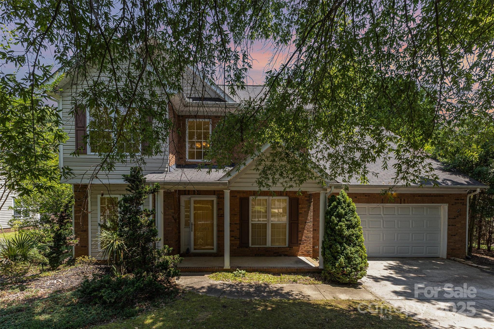Fantastic investment opportunity in a desirable Indian Trail neighborhood! This two-story fixer-upper features 4 bedrooms, 2.5 bathrooms, and a spacious layout with tons of potential. The home includes a cozy gas fireplace in the living room, plenty of built-in shelving and storage throughout, plus a washer, dryer, and refrigerator that are included with the sale. The primary suite offers tray ceilings, an ensuite bath with dual sinks, a separate soaking tub and shower, and a large walk-in closet. A true two-car attached garage adds convenience, and the large, level backyard is fully usable—perfect for future outdoor living or play. Being sold as-is, this property is ideal for investors or buyers looking to take on a project in a high-demand area with great community amenities!