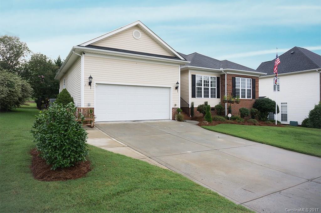 MUST SEE! LAKE FRONT COMMUNITY! SHOWS BETTER THAN A MODEL! UPGRADES GALORE! New Paint, Surround Sound. Upgraded Stainless Steel Appliances and Roll Out Shelves, Granite Countertops, Travertine Backsplash, Bamboo Wood Floors and Tile Throughout! Gas Fireplace w Blower. Relax on your Composite Wood Deck under your Electric Louvered Canopy that can be Opened or Closed at the touch of a button. Fenced Back Yard w 12x16 Storage Shed. HEATED/COOLED Garage. Enjoy Dinner at Restaurant Overlooking Lake!!