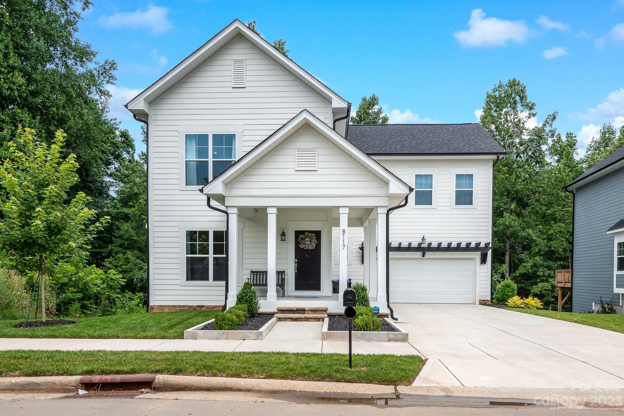 Spectacular home in the Oaks of McIlwaine! This beauty is almost new construction in an established neighborhood with a finished basement!  Farmhouse style with 4 bedrooms including 2 primary suites with large walk in closets. The open floor plan boasts a cook's kitchen with white cabinets, granite countertops, white subway tile backsplash, soft close cabinets, ss appliances, and vinyl plank flooring throughout. The secondary bedrooms are large with a jack and jill bathroom w/ granite countertops. This home has a basement w/ high ceilings and a half bathroom. Ready for entertaining with an extended paver patio and a private wooded backyard that is fully fenced.  You can take a hike at Latta Nature Preserve or take a quick drive to nearby shops and restaurants in desirable Birkdale Village. Conveniently located within minutes of K-12 Education, Richard Barry Memorial Park, Greenway, Hospital, Dining and Shopping.