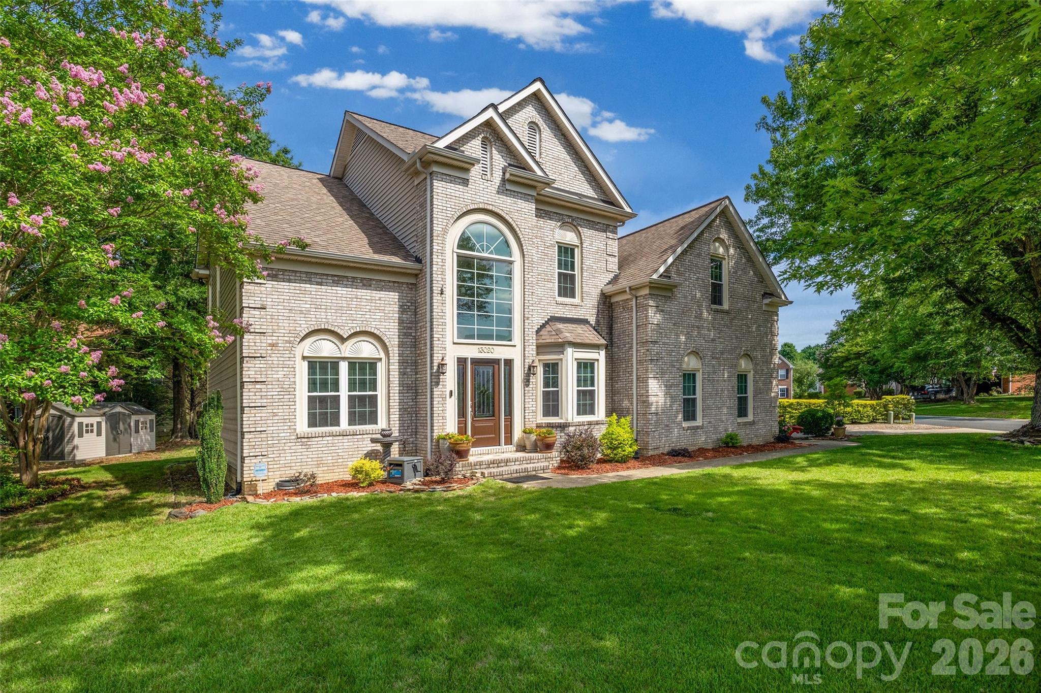 Welcome to this beautifully updated and thoughtfully refreshed home, ideally positioned on a desirable corner lot at the edge of a cul-de-sac. From the moment you enter, the grand two-story foyer and soaring ceilings create a stunning first impression, setting the stage for the spacious and inviting interior that follows. The versatile front sitting room offers endless possibilities as a home office, playroom, or formal living space, while the elegant dining room is perfect for hosting gatherings.  The kitchen features granite countertops, stainless steel appliances (updated in 2021 and 2025), an eat-in breakfast area, built-in desk space and drop zone. Upstairs, the spacious primary suite showcases vaulted ceilings, a private ensuite bath, and an upgraded walk-in shower completed in 2020. Additional bedrooms provide ample space for family, guests, or flexible work-from-home living. Designed for immediate enjoyment, the home has been refreshed for the market with Scraped ceilings and fresh interior paint throughout, updated lighting fixtures, upgraded hardware. The backyard is ready for spring and summer with fresh seed and straw, a brand-new deck (2026) overlooking the backyard and a storage building situated on a permanent pad. Additional improvements include replacement windows (2016), roof (2010), siding (2020), and gutters (2020), offering both style and peace of mind. Residents enjoy exceptional community amenities including a pool, clubhouse, playground, picnic area, and scenic walking and biking trails connecting to the neighborhood school and recreation areas. Conveniently located less than 5 miles from Carowinds, RiverGate Shopping Center, Ayrsley Town Center, dining, shopping, and entertainment. Enjoy easy access to Uptown Charlotte, Ballantyne, Fort Mill, Anne Springs Close Greenway, and Charlotte Douglas International Airport, all within approximately 20 minutes. Blending timeless appeal, thoughtful updates, and an exceptional location, this move-in-ready home delivers the lifestyle today's buyers are searching for.
