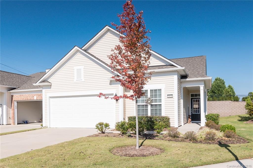 Popular Muirfield Villa model w/ screened porch, private back yard and huge side yard! Foyer leads to library & spacious great room. Kitchen w/ granite countertops, cabinet pull outs, island, and dining nook w/ great natural lighting. Lovely dark hardwoods throughout living areas! Plus fine details such as wainscoting, crown molding, 3 ceiling fans, and deadbolts on all doors. Experience easy living in this 55+ active adult community.