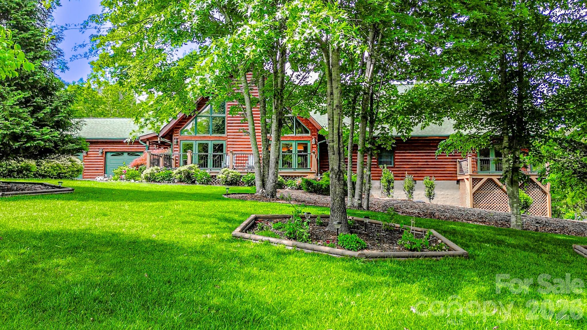 Experience the perfect blend of rustic luxury and mountain charm at 371 Hickory Loop in Rutherfordton NC. This stunning fully furnished log home located in a gated community, offers 5 spacious bedrooms and 4 bathrooms, creating plenty of room for family, guest, or a private mountain retreat. From flatware to fixtures this property is being offered completely furnished, making it truly move-in ready and ideal for a primary residence, vacation getaway, or investment opportunity. From the moment you walk inside, you're greeted by a breathtaking vaulted living room featuring a massive floor-to-ceiling stone fireplace that serves as the centerpiece of the home. Warm wood tones, soaring ceilings, and natural craftsmanship create the inviting atmosphere buyers dream of in a luxury mountain home. The gourmet kitchen is designed for both entertaining and every day living, offering ample workspace, quality finishes, and an open flow into the main living areas. Step outside to enjoy the beautifully landscaped grounds and fenced-in backyard complete with a full home Generac generator and ample storage shed. This backyard area is perfect for pets, gatherings, or simply relaxing in your own private outdoor oasis. Conveniently located in the heart of Western NC, this exceptional property is just a short drive to Asheville, the renowned Tryon International Equestrian Center and beautiful Lake Lure / Chimney Rock. Enjoy easy access dining, outdoor recreation, hiking, wineries, shopping, and all the mountain lifestyle has to offer while still enjoying the peace and privacy of Rutherfordton living. 
371 Hickory Loop is a rare opportunity to own a turnkey luxury log home in one of North Carolina's most desirable mountain regions.