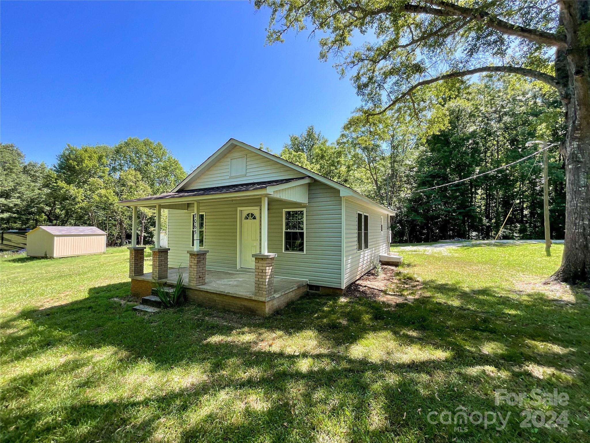 Sweet, remodeled home nestled among tall trees on 2.6 acres of beauty, privacy, and peace. A second full bath was added and laundry hook-ups were added in the mudroom. All new in 2024: flooring; kitchen cabinets, countertops, island, range, microwave; windows and doors; drywall, paint and trim; bathroom vanities, commodes and shower/tub combos; vinyl siding on home; roofs on home and shed; all fixtures including lighting; HVAC and water heater. It will be a decade or two before any major home expense is needed; plenty of time to prepare. And plenty of room outside for gardens, pets, play and more.