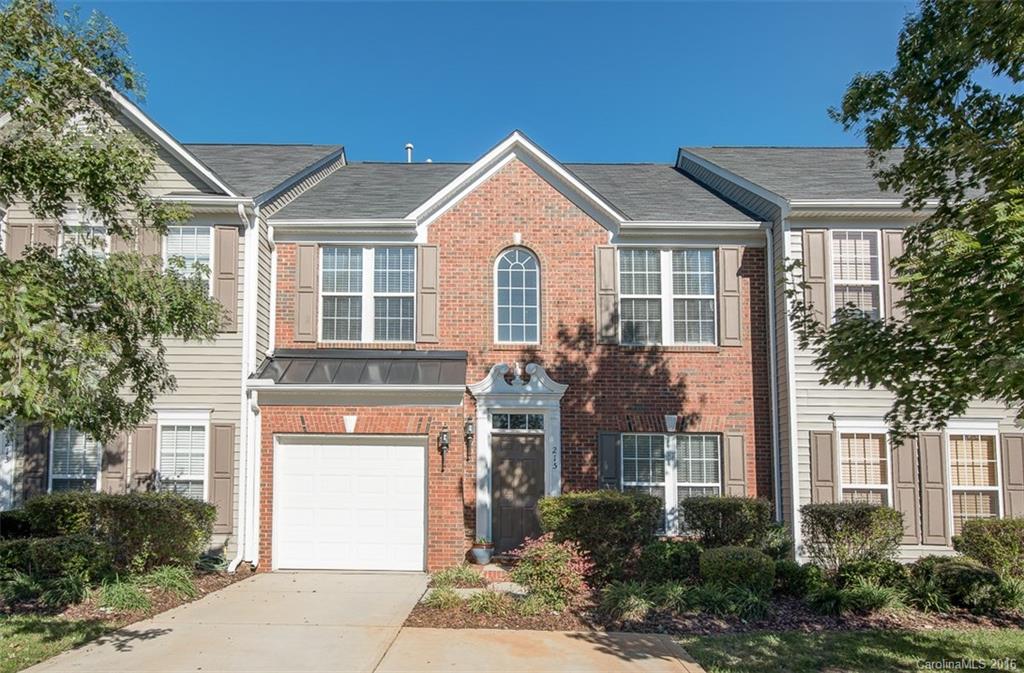 Beautiful townhome with new flooring, paint, light fixtures, granite & dishwasher! Bring your pickiest buyers; they will not be disappointed! Open floorplan on main level with bright sunroom & vaulted ceiling, flowing out to private patio area. This move in ready home has a spacious garage and extra parking pad. The dining and master bedroom have tray ceilings. All bedrooms have ceiling fans and Master Suite comes complete with walk-in closets, spacious vanity, garden tub and shower.