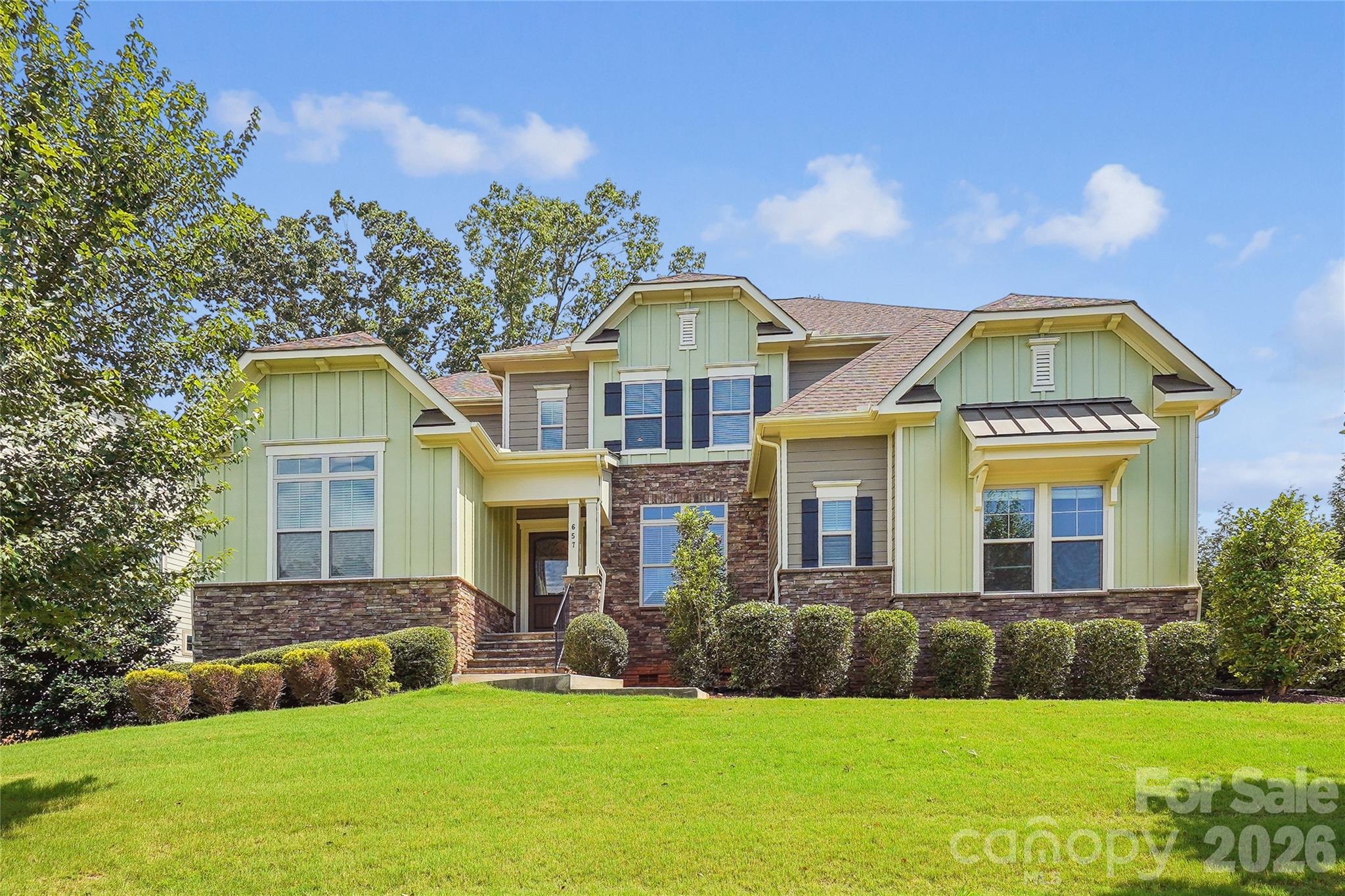 Nestled in highly desirable Eppington South, this freshly painted 5-bedroom, 4.5-bath home offers living spaces designed for both relaxation and entertaining. Step inside to discover an inviting living room filled with natural light and cozy fireplace.  At the heart of the home is the expansive kitchen featuring a large island with granite countertops, walk-in pantry, butler's pantry and breakfast area.  The formal dining room is ideal for hosting.  A main-level guest suite provides comfort and privacy for visitors. Owner's suite, a true sanctuary with dual walk-in closets and a luxurious bathroom. Loft, 3 additional bedrooms, 2 full bathrooms with new marble tile floors, and laundry room complete the upstairs.  Enjoy outdoor living in the partially covered wraparound deck complete with skylights.  3-car attached garage. Located near top-rated Fort Mill Schools, Baxter Village, Kingsley, Lake Wylie, Anne Springs Close Greenway, and easy access to I-77 to Charlotte.